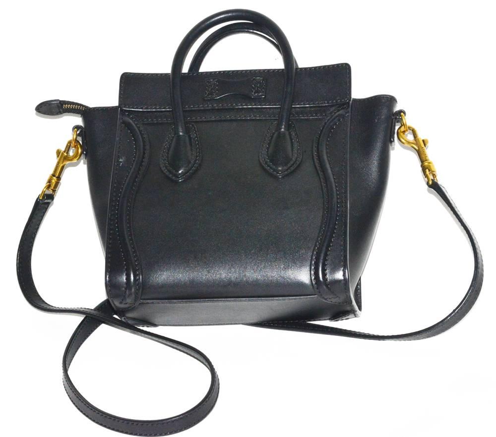 This is a beautiful black leather Celine MINI trapezoid bag.  Holds everything you need! Top handle and detachable cross body strap, in pristine condition. Retail is $2800.