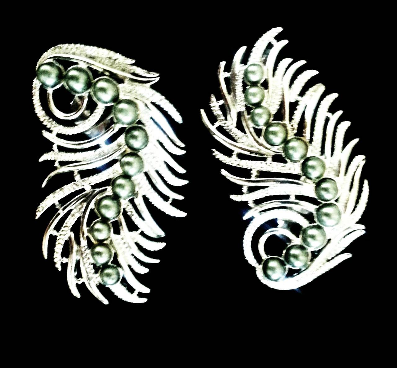 Unique and highly collectable silver and pearl ear cuff earrings made for Audrey Hepburn (who can be seen wearing them in image 3).

The earrings were created for Ms Hepburn by the famed American designer Sarah Coventry, whose clients included