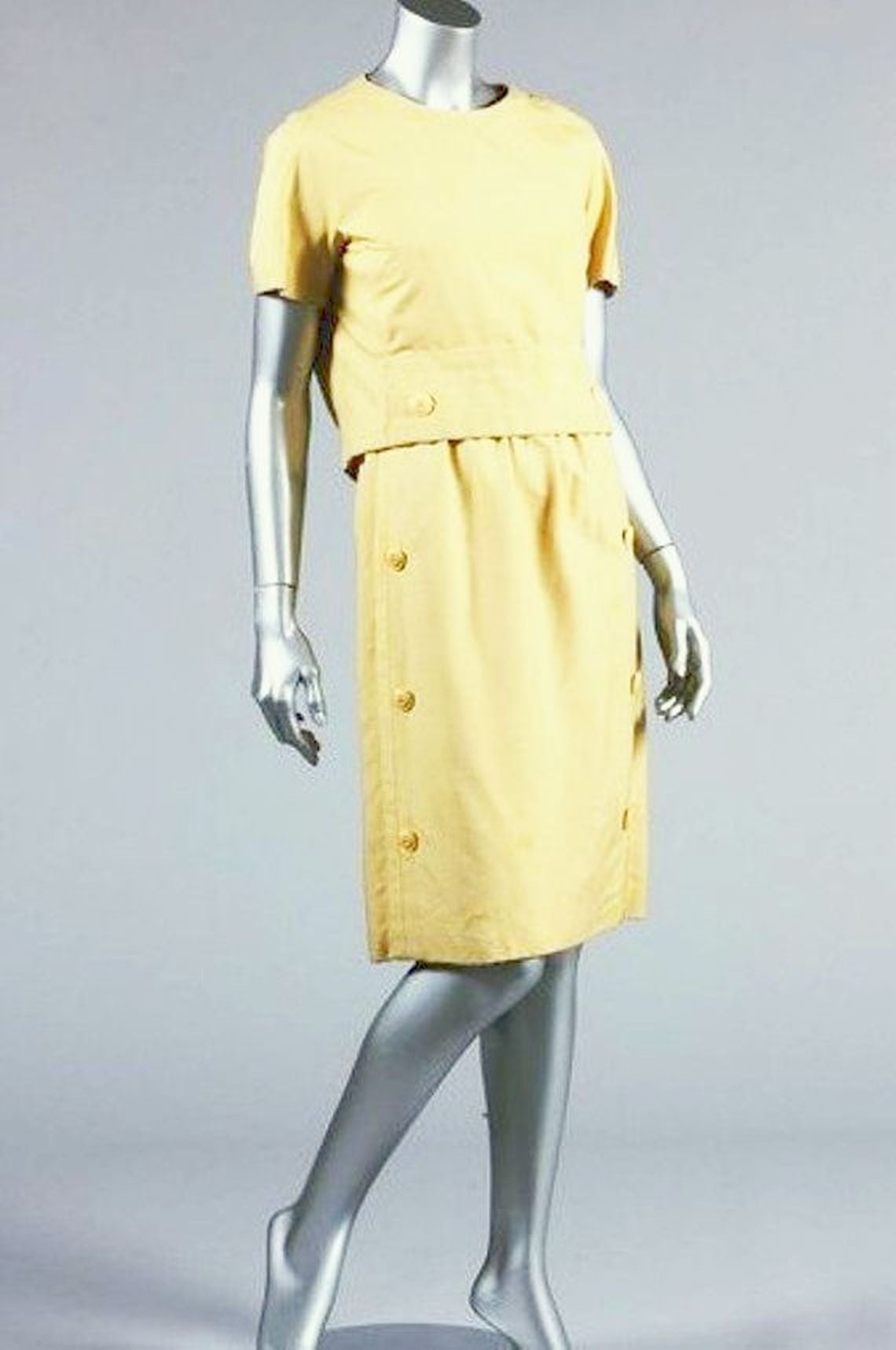 A pale yellow late 1950s numbered Christian Dior Haute Couture silk cocktail or day dress, originally made for Margaret, Duchess of Argyll.

A wonderful way to introduce vintage couture into your wardrobe, this dress is a very clever piece of