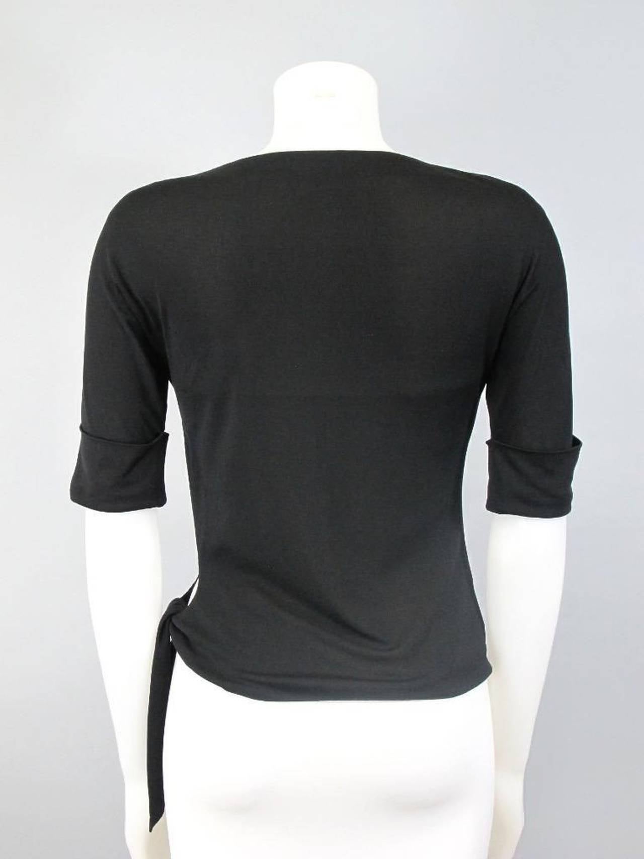 Late 1960s or early 70s Couture Emilio Pucci Black Silk Slashed Tie Top For Sale 1