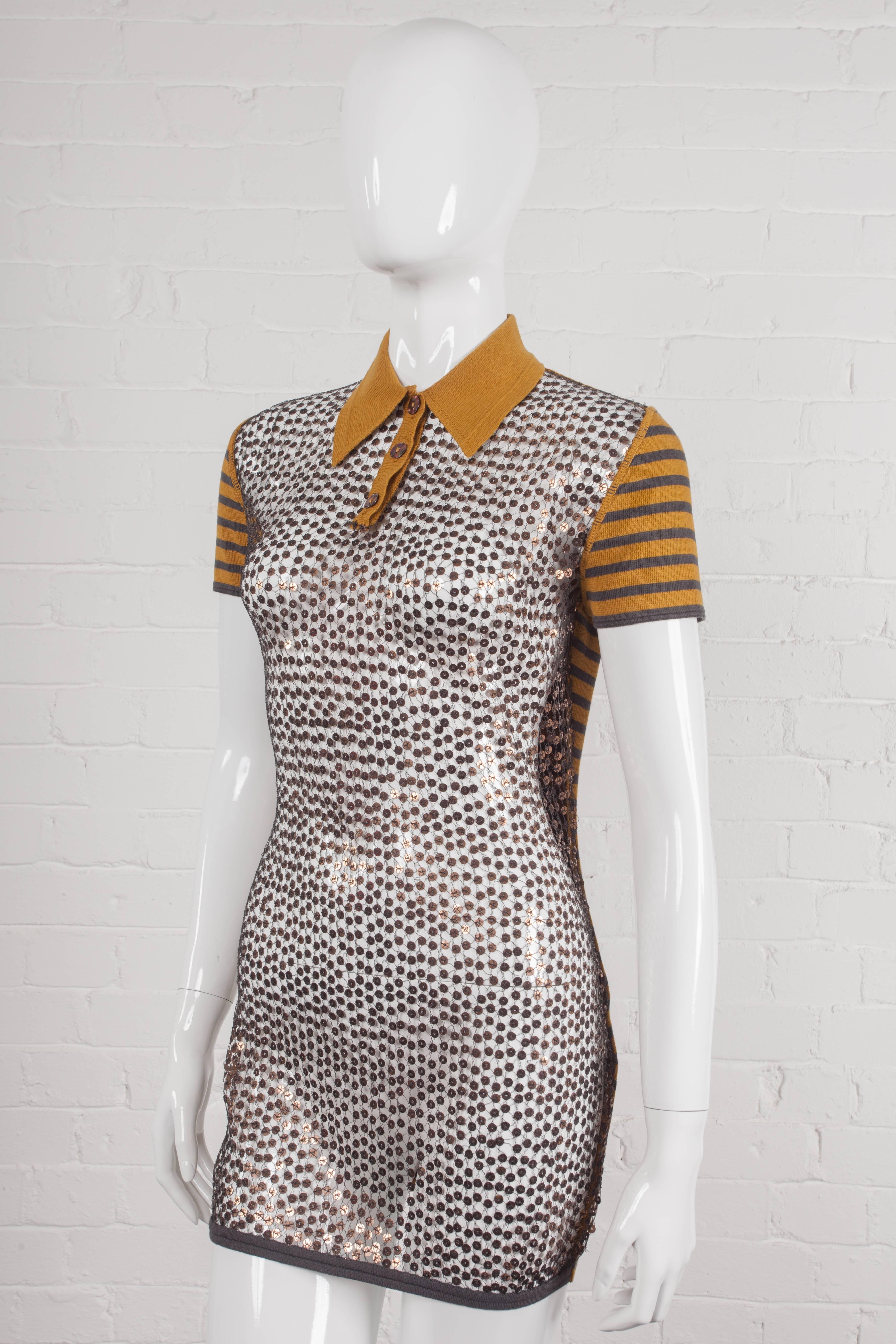 Long top with a sequinned see-through net front. From the Spring/Summer 1990 “Rap’Prayers” Collection. Features a polo neck collar and Mother of Pearl buttons, stretch cotton short sleeves and back section in contrasting stripes.
Period: 1980s –
