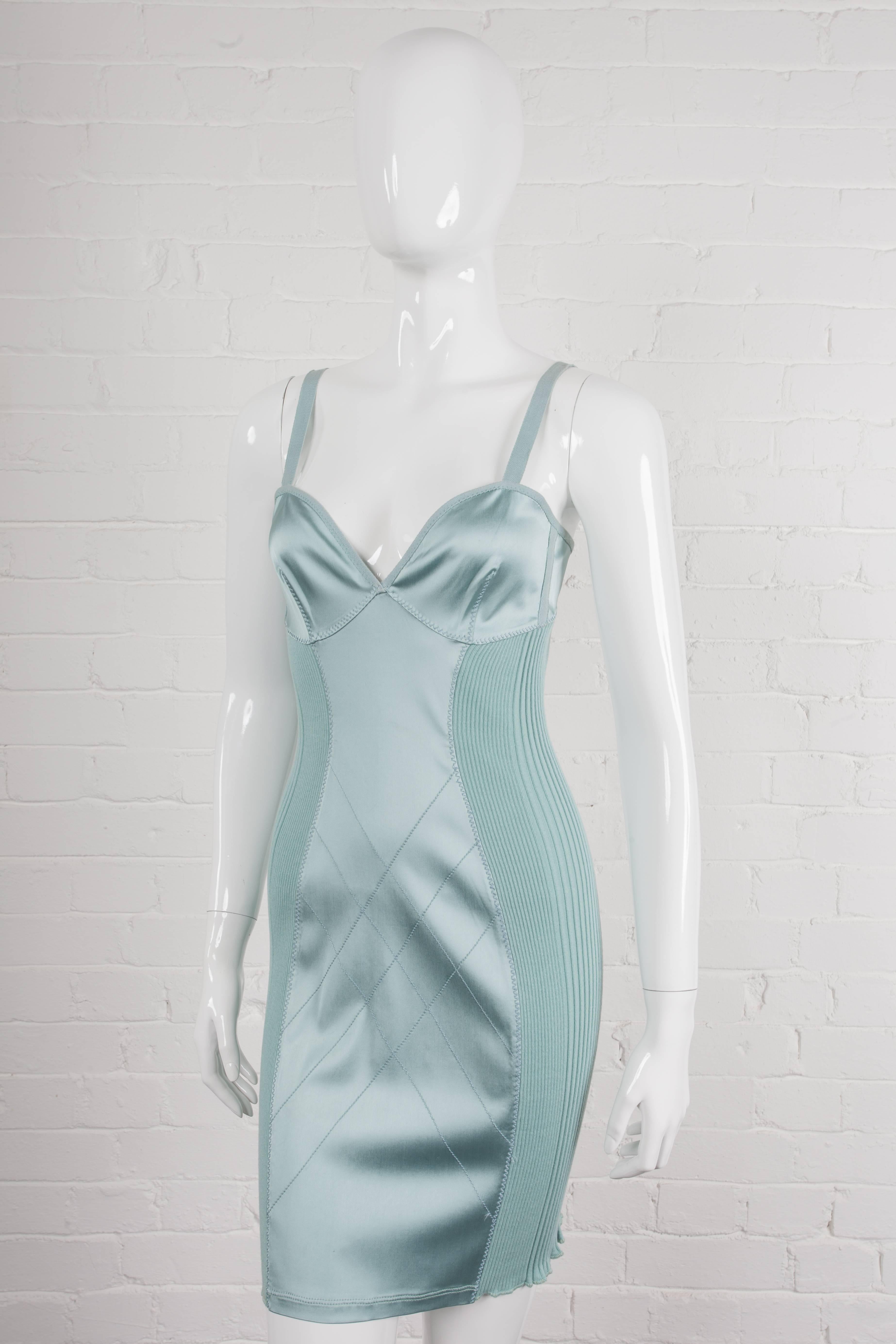 Vintage 1992 negligé dress.

A lingerie-style fitted dress made from viscose rayon and lycra with cotton ribbed side panels. From the Spring/Summer 1992 “Elegance Contest” Collection.  Features cotton taped shoulder straps and binding, a diagonal