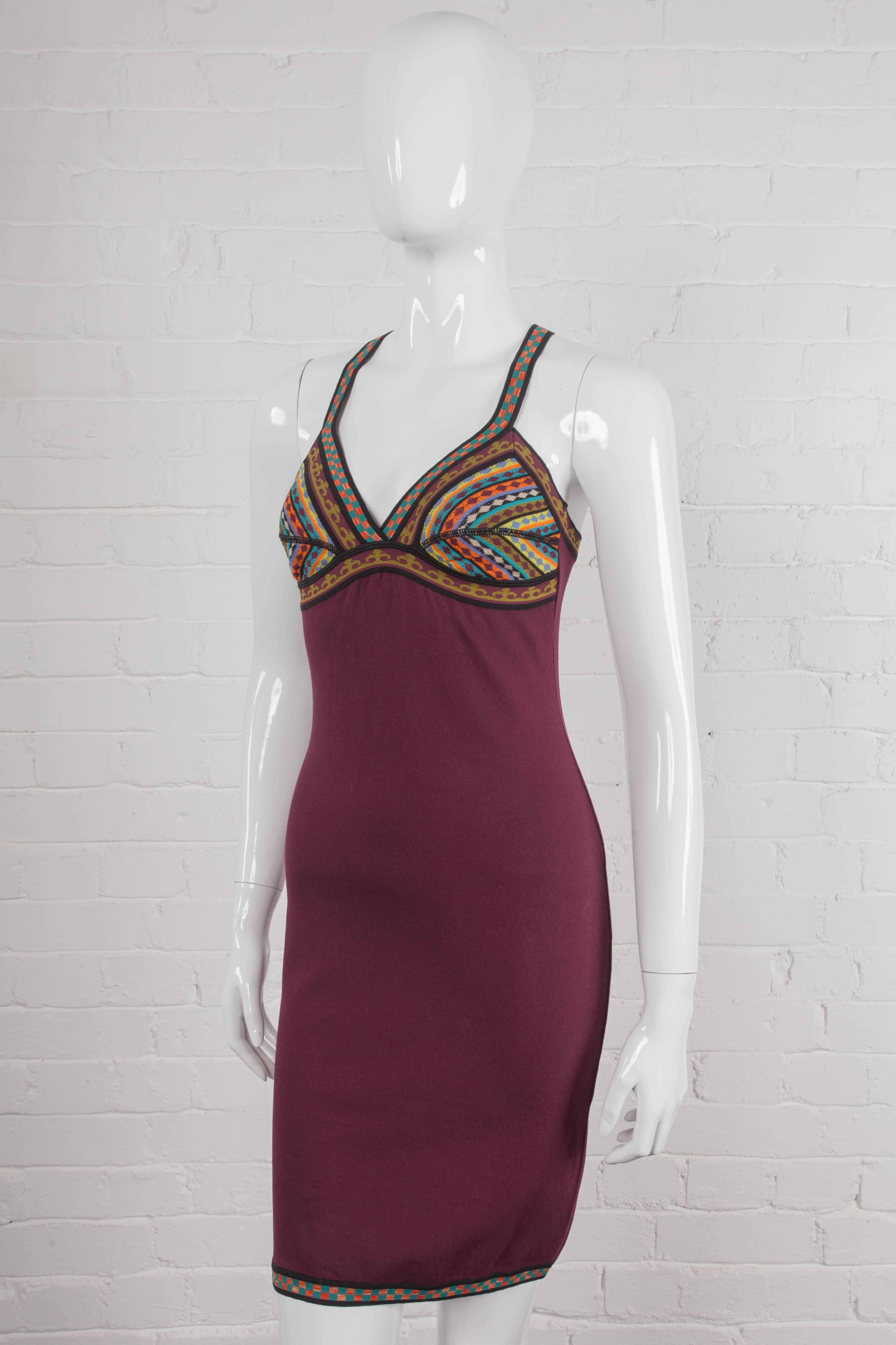 Vintage 1991 bodycon dress

Maroon fitted dress with added cotton and cross-over straps at the back in a heavy stretch viscose. From the Spring/Summer 1991 “The Couple – Adam and Eve, Today’s Rastas” Collection. Features shaped cups in various