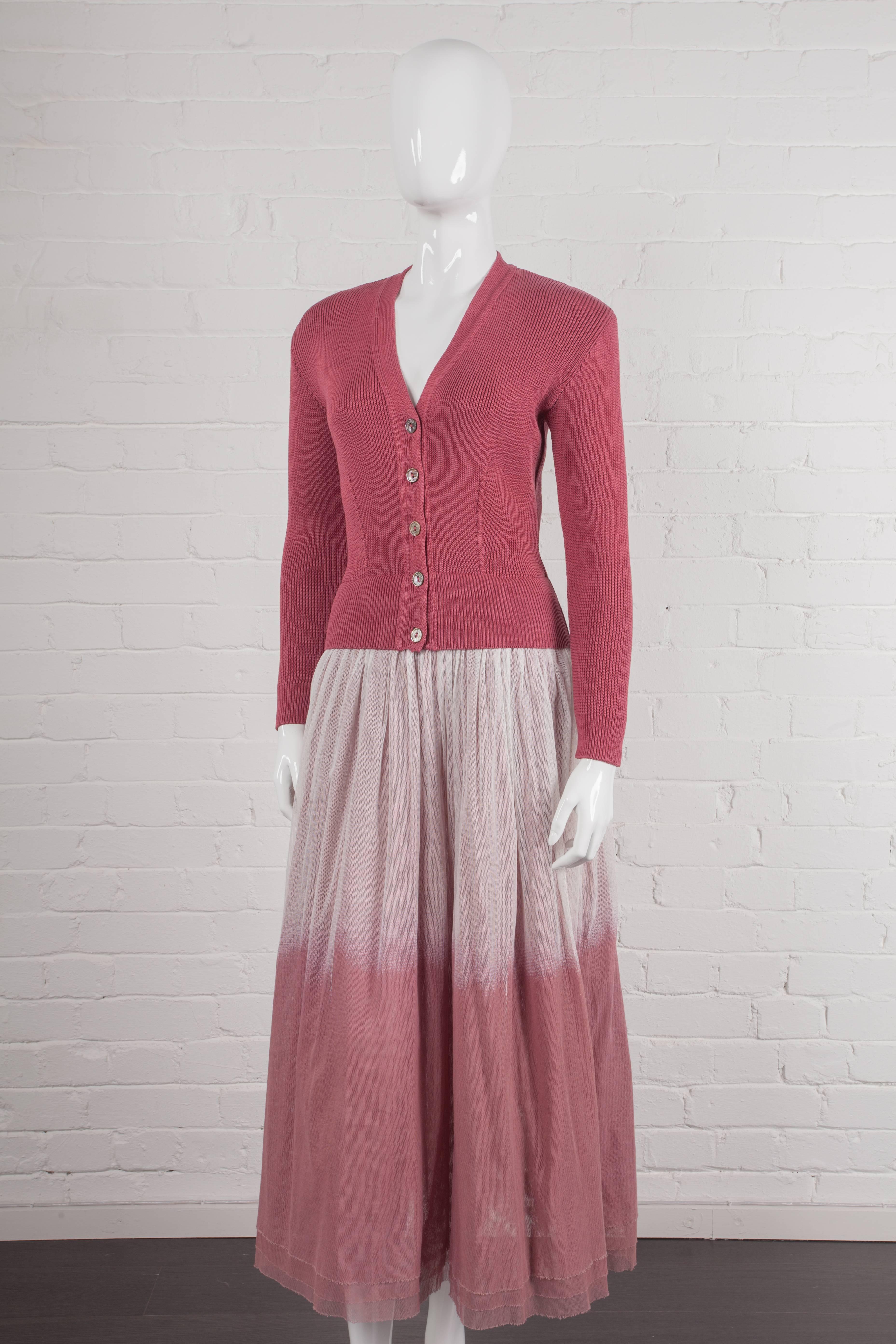 Vintage 1991 trompe l'oeil dress

All-cotton ankle-lengthdress with attached medium-weight stretch ribbed cardigan which has a front opening with Mother of Pearl buttons and dart shaping at the front and back. From the Spring/Summer 1991 “The