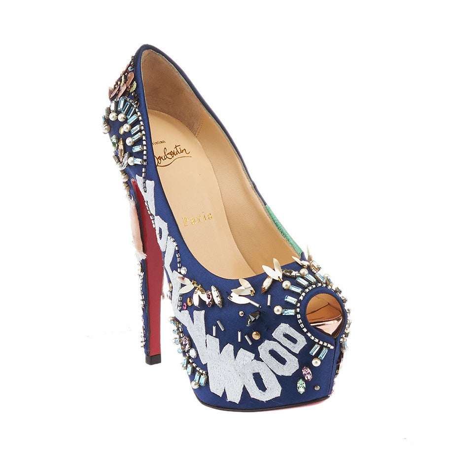 These Christian Louboutin Highness 160 pumps were created to commemorate the company's 20th anniversary. Each pair is signed by Loutboutin himself: the left shoe is New York themed, while the right one is Los Angeles themed. They feature a peep toe