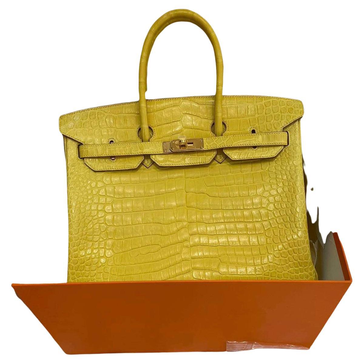 This is the authentic RARE HERMES crocodile Birkin 35 in Mimosa with gold hardware. Extremely rare combination.
While Hermès is known for their incredible colors, their selection of yellows alone spans many shades. This stunning 35cm Mimosa Birkin