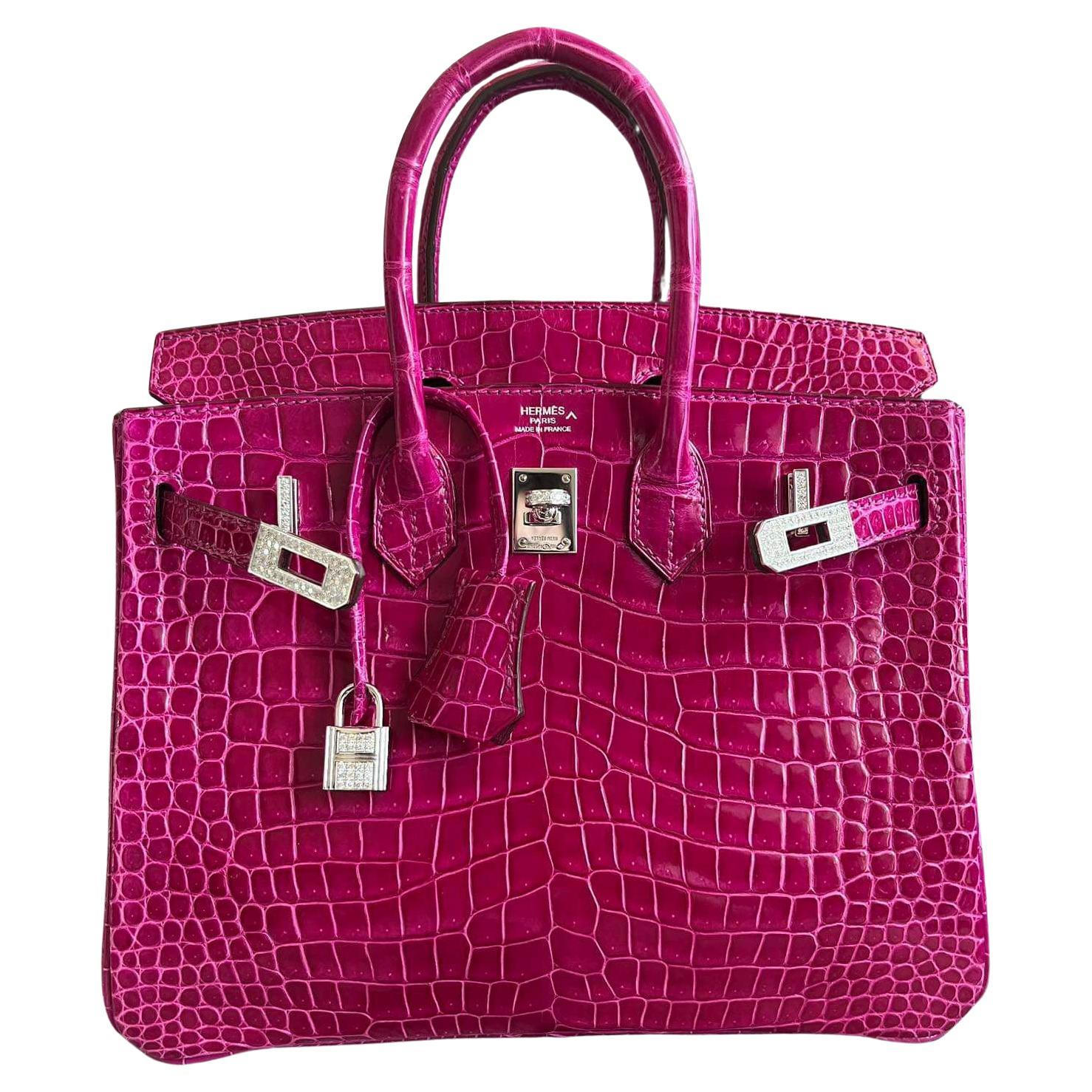 Beautiful Hermes Birkin 25 Shiny Porosus Crocodile with diamonds and 18K white gold. Bag is in mint pristine condition. Comes with dust bag, box(little broken), Clochette, keys,CITES and rain coat.
Hermes diamonds not aftermarket. X stamp.
Beautiful