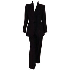 1990s Yves St Laurent black wool twill nipped waist trouser suit