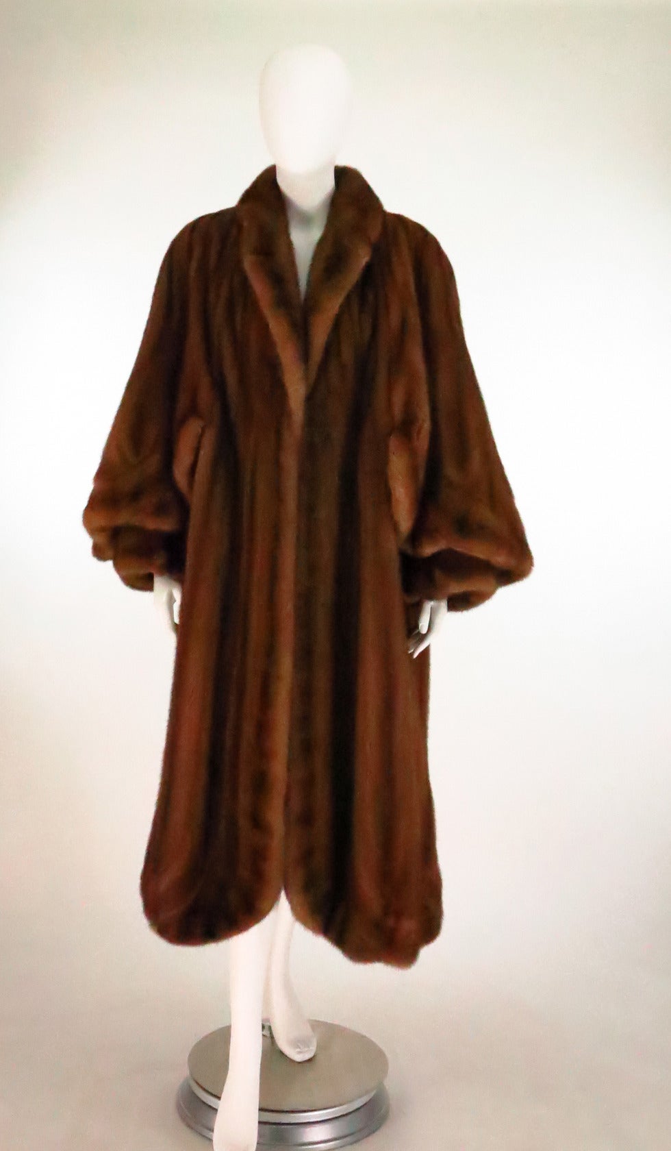 What a beautifully made coat!!! From the 1950s it is soft and supple and the warm chestnut pelts glisten...Technically a 