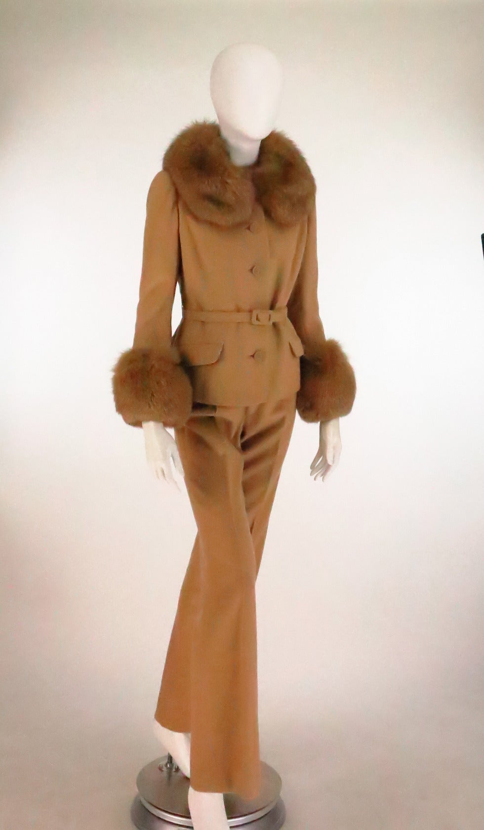 Chic trouser set from the 1960s in 100% camel hair and trimmed in lush soft golden red fox fur...From Martha, Palm Beach...Looks barely, if ever worn...The single breasted jacket has long fur trimmed sleeves, a narrow self belt at the waist and a