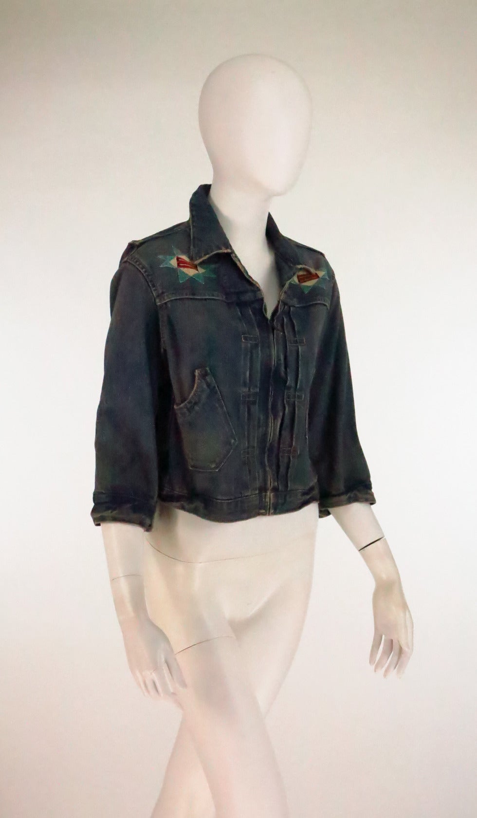 Ralph Lauren, Double RL beaded distressed denim jacket...3/4 length sleeve jacket closes at the front with a zipper, copper buttons at each sleeve cuff...Traditional denim flat felled seams...Front shaped open pockets at each side...Hand beaded