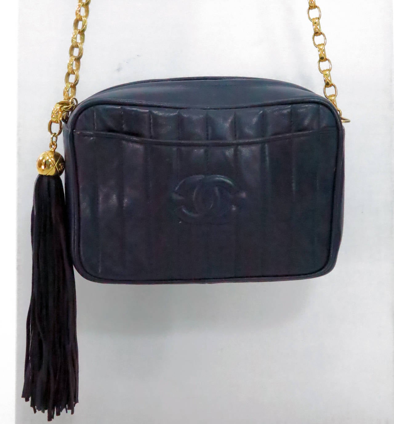 1980s Chanel navy blue lambskin camera bag with tassel at 1stDibs