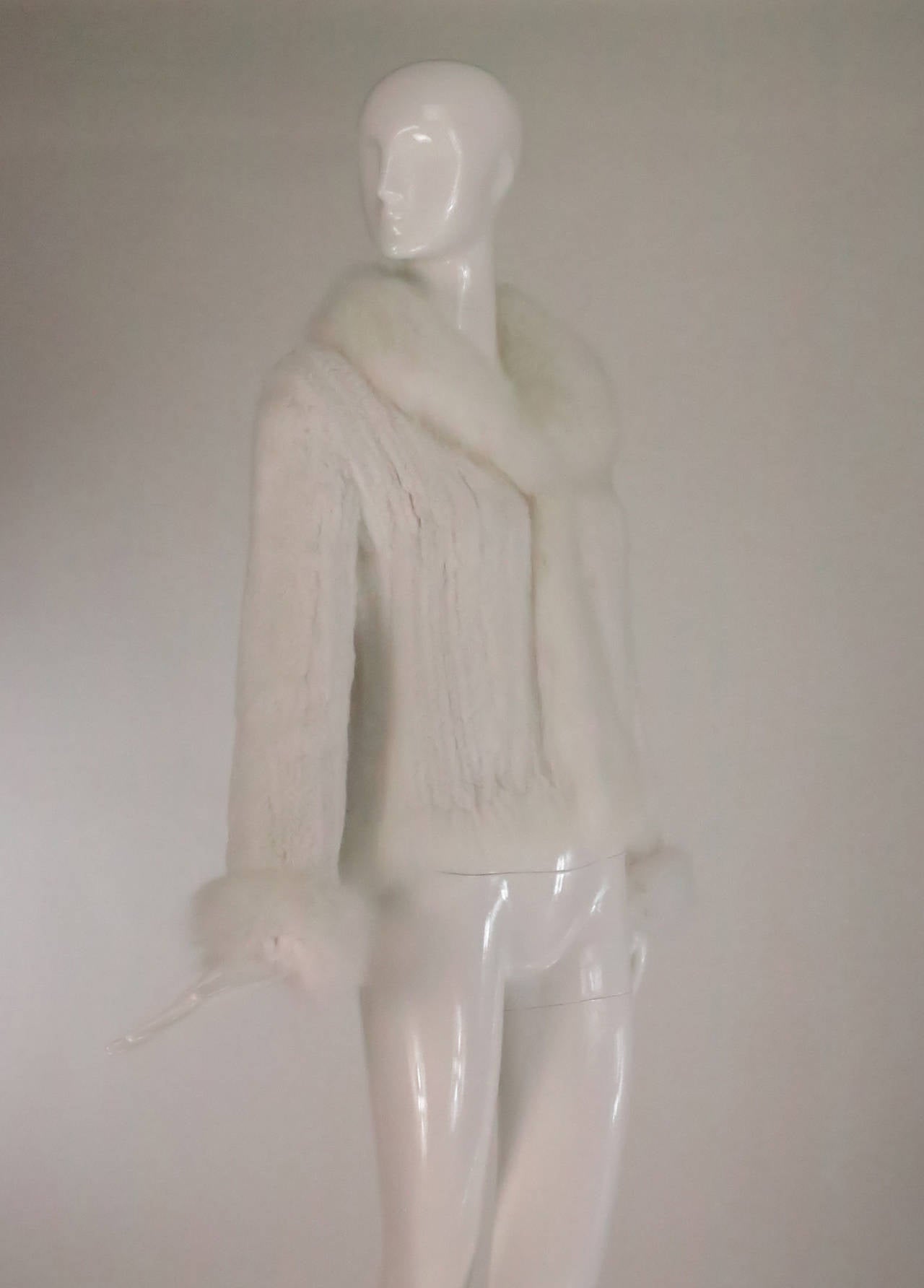 Snow white knitted rabbit fur jacket with fox fur collar & cuffs made in France...Unlined closes at the front with a fur hook & eye...Fits like a small...Perfect for a winter wedding!

In excellent wearable condition... All our clothing is dry
