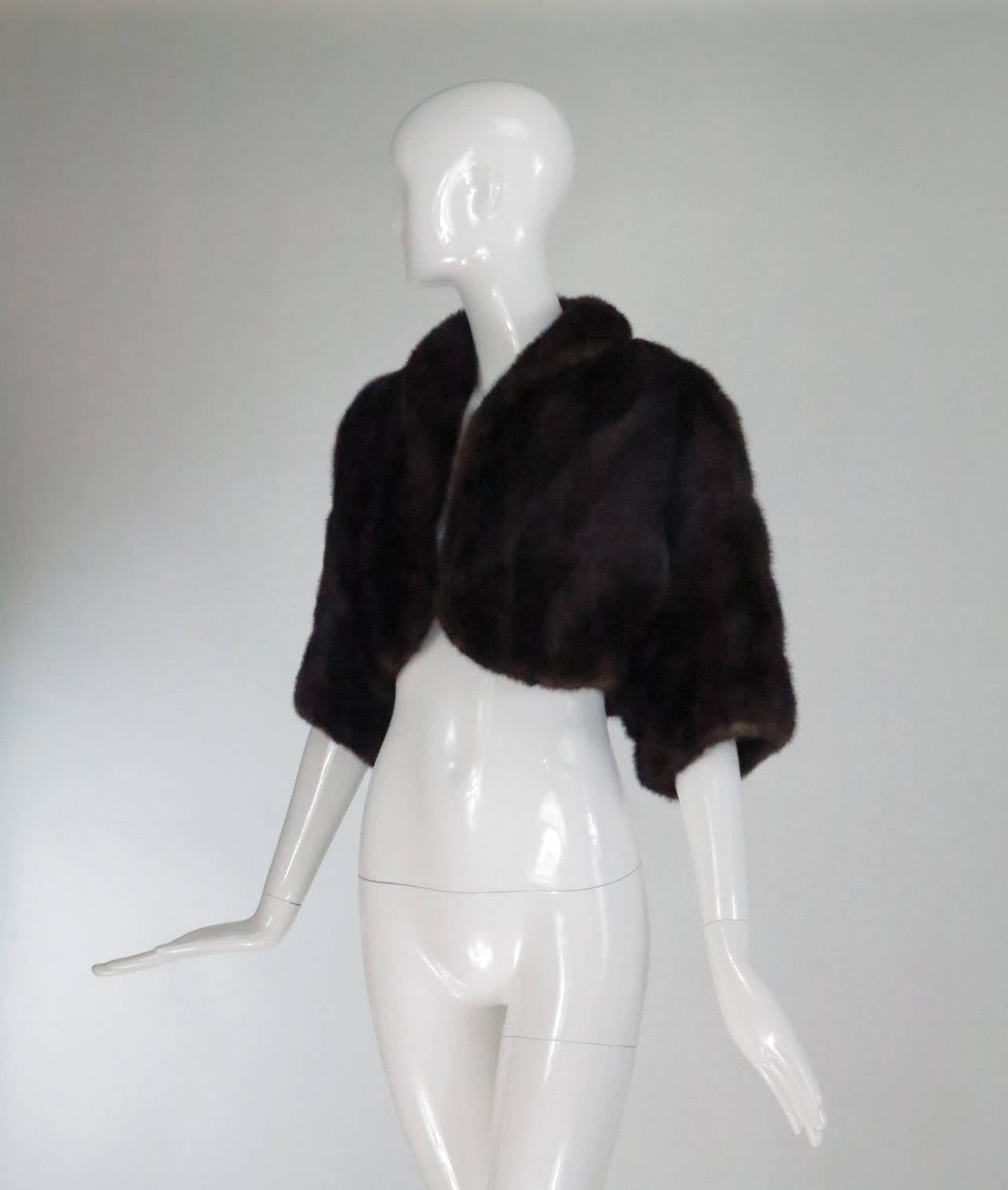Elegant rich dark mink fur evening jacket, perfect for a special event or wedding...Short cropped style has a shawl collar, 3/4 length sleeves and closes at the front with a single fur hook...Lined in dark chocolate brown brocade...Fits like a