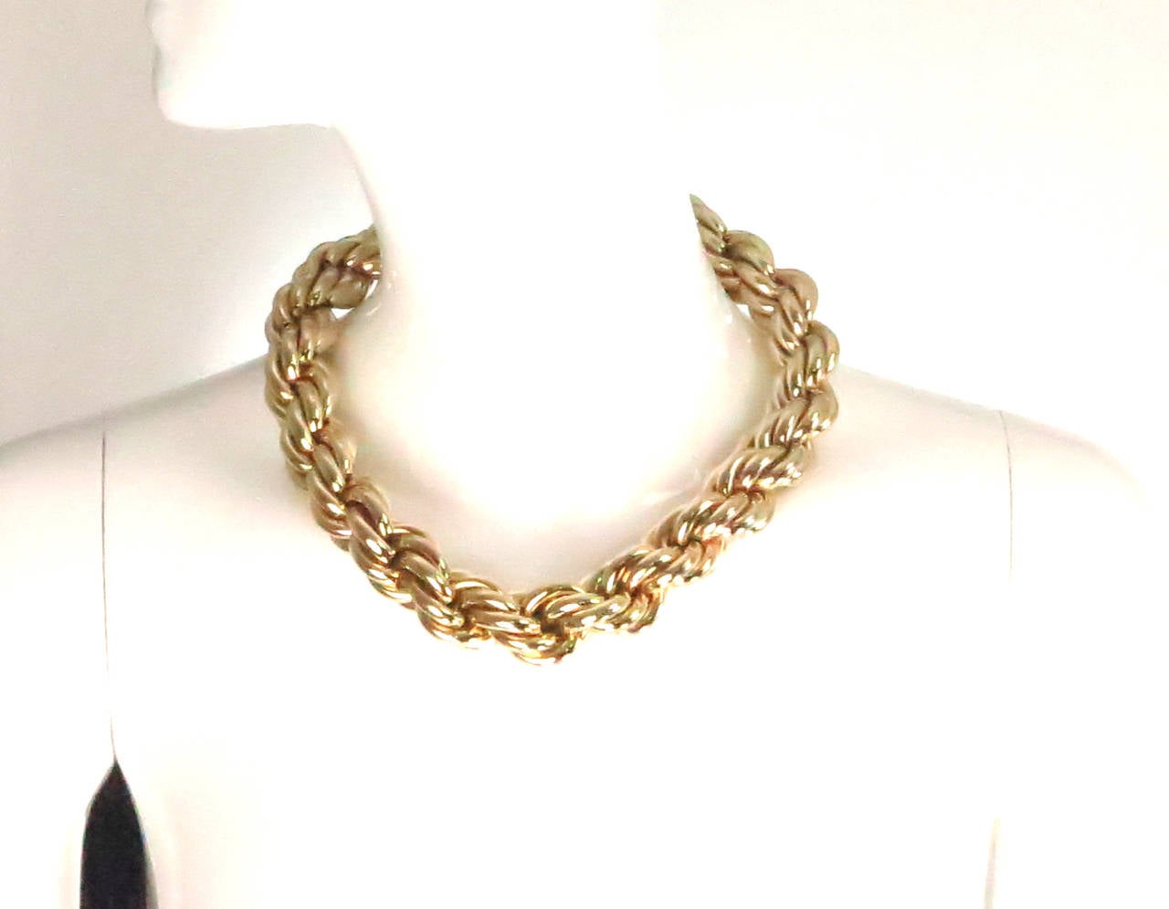 Massive gold link necklace from the 1980s by Napier...A little longer than choker length, this piece is great for filling in a neckline...Good quality costume piece with the look of real...Marked Napier on the attached hang tag...

Measurements