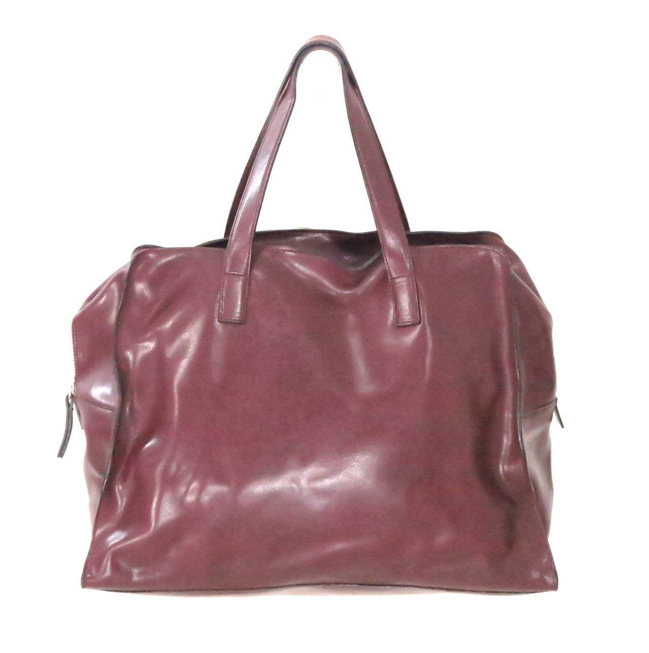 Gorgeous deep burgundy leather double handle tote bag/handbag, from Gabriele Strehle for Strenesse...Large roomy tote has a zipper top, large open compartment inside and open compartments on either side (inside)...The bag is unlined and looks like