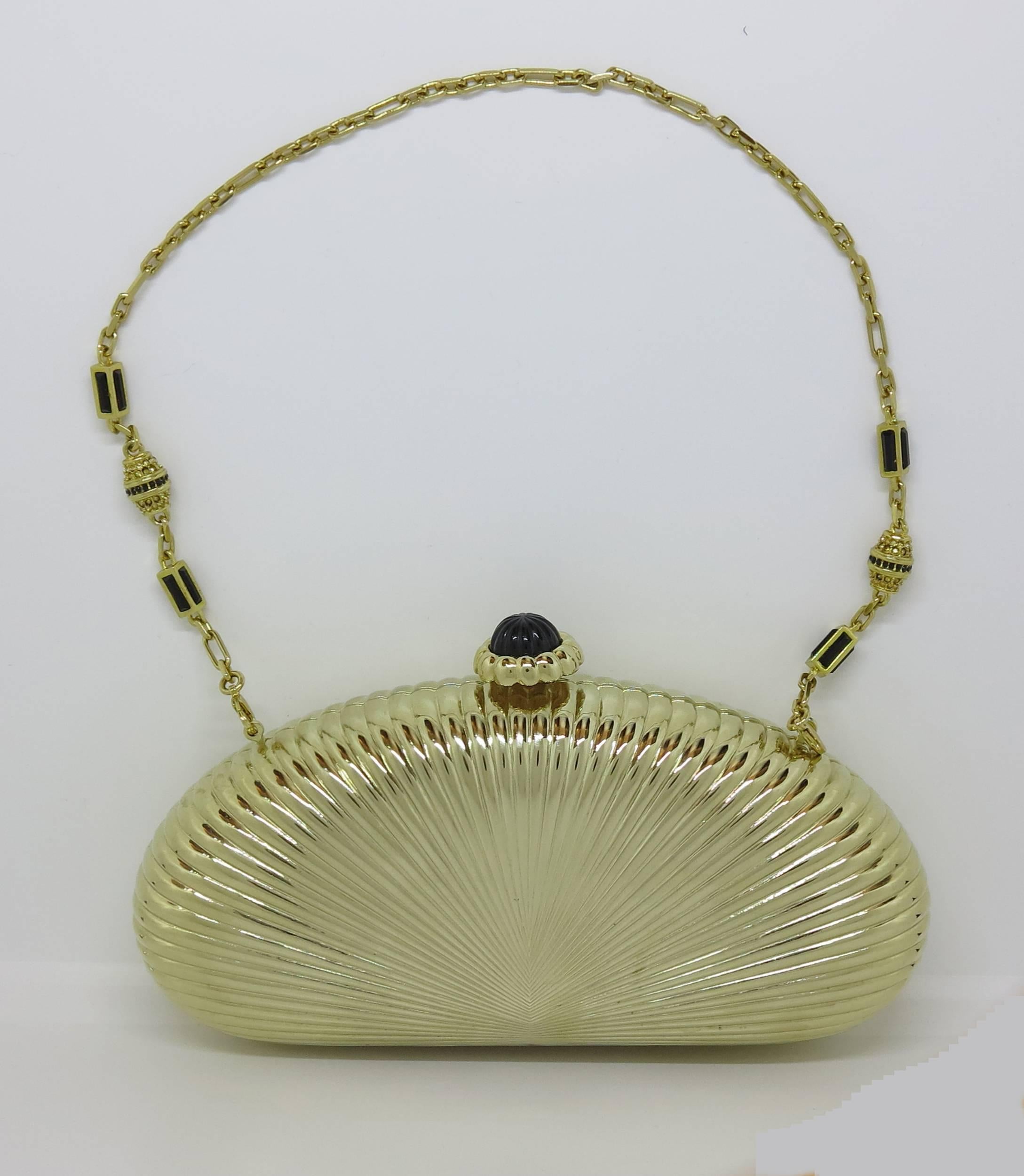 Judith Leiber gold sunburst hardside evening clutch or shoulder bag...Beautiful bag with jewel gold chain handle strap, press to open black stone set top...Interior lined in gold...Looks barely, if ever worn...original tag price $2695...Measurements