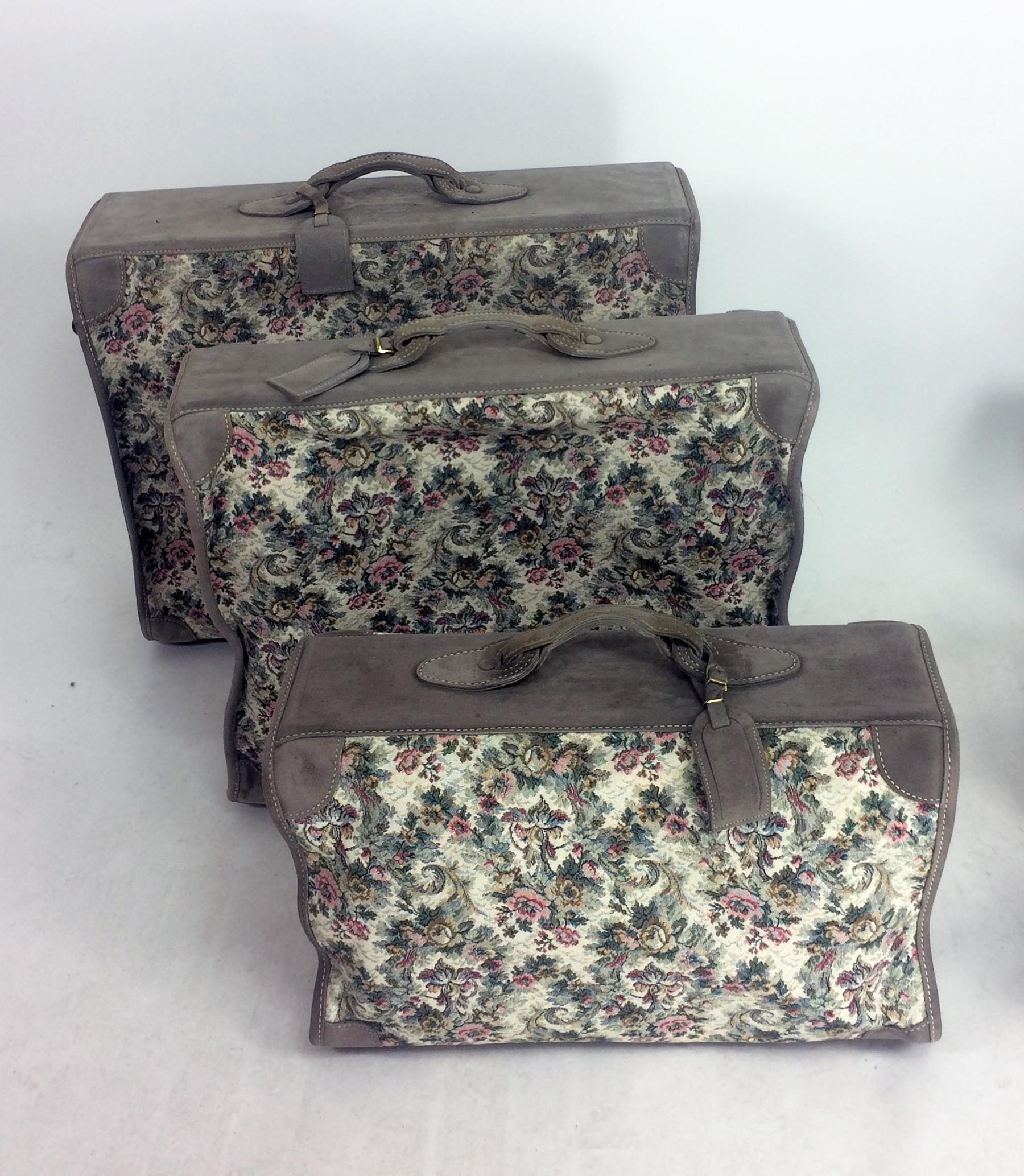 French Luggage Co. Floral Tapestry and suede Six Piece Luggage Set from the 1988. This six piece set of luggage is made by French of California, America's finest handcrafted luggage. Beautiful floral tapestry woven fabric in shades of pale grey with