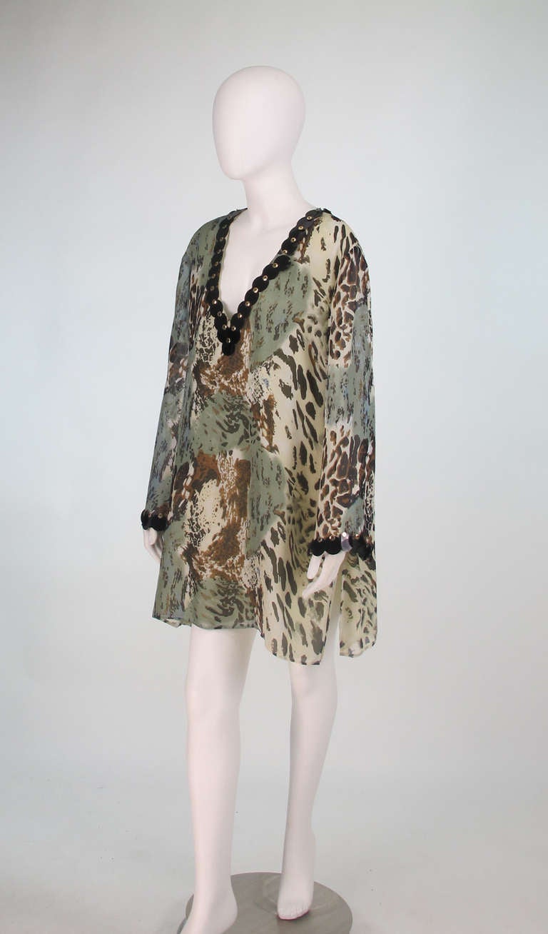 Designed by Lady Eugenie Nuttall in the Bahamas and sold in designer boutiques throughout the Caribbean & in London... Jeannie Mc Queeny leopard print sequin/beaded silk tunic...In camo print with wide flowing sleeves, deep V neckline and trimmed in