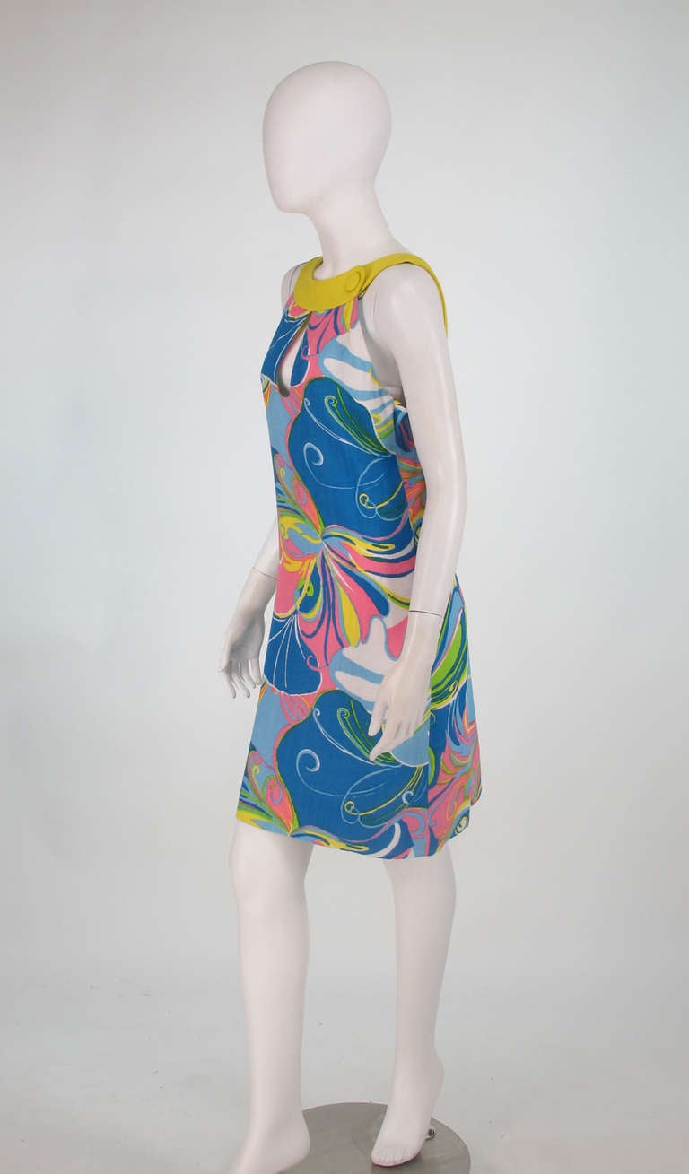 Swinging 60s, vivid butterfly print mod style dress from Pierre Cardin...Linen blend fabric with coordinating yoke and back straps...Key hole front detail and low scoop back...Large self button accents...Fully lined...Closes with back zipper...A
