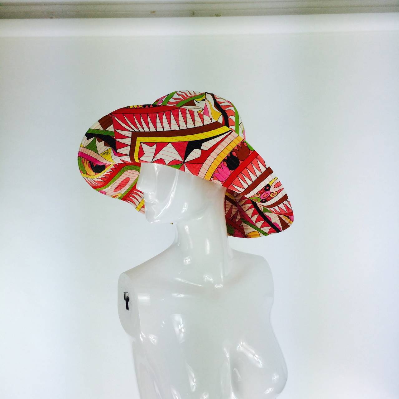 From the early 21st century a wonderful Pucci wide brim sun hat...Bright colours in the geometric designs Pucci was famous for...All cotton...

Measurements are:
21 3/4