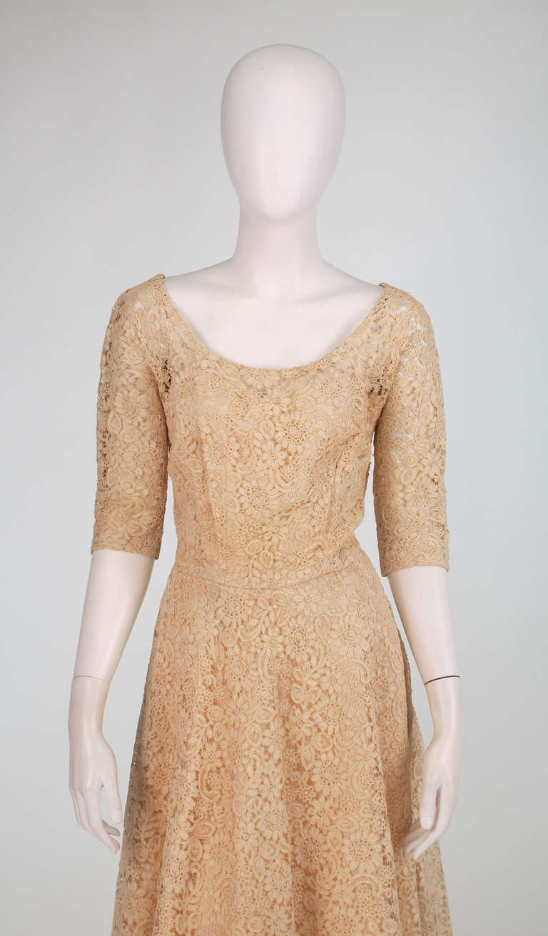 1950s custom made cream Guipure lace afternoon dress...This dress came from an estate that had a live in dressmaker!  Made from fine quality Guipure lace in a bone colour...Scoop neckline front and back, 3/4 length sleeves...Fitted bodice with