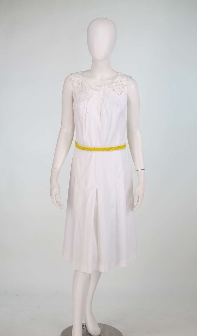 Prada white stretch cotton applique lace & beaded trim dress...The perfect little summer dress! Sleeveless with scoop, tucked neckline, white beaded/lace trim at the shoulders, the back neckline has yellow beading...With matching beaded ribbon