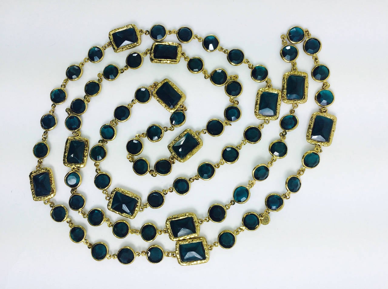 Gorgeous chicklet necklace from Chanel 1981, in teal/green depending on the light the colour looks teal/aqua/green...Pair this with pearls or chains for the classic Chanel look...Bezel set emerald stones in roundels and 