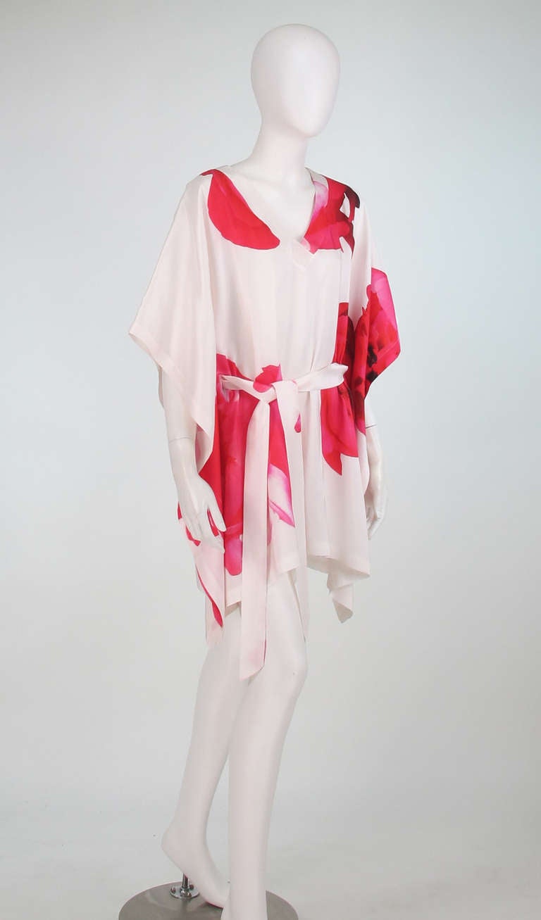 Jaeger London silk photo floral caftan tunic...Pull on silk caftan/tunic with a digital floral photo print...Bright pink flowers pop against the white background...With self tie belt and belt openings in the fabric...Unlined...Marked size