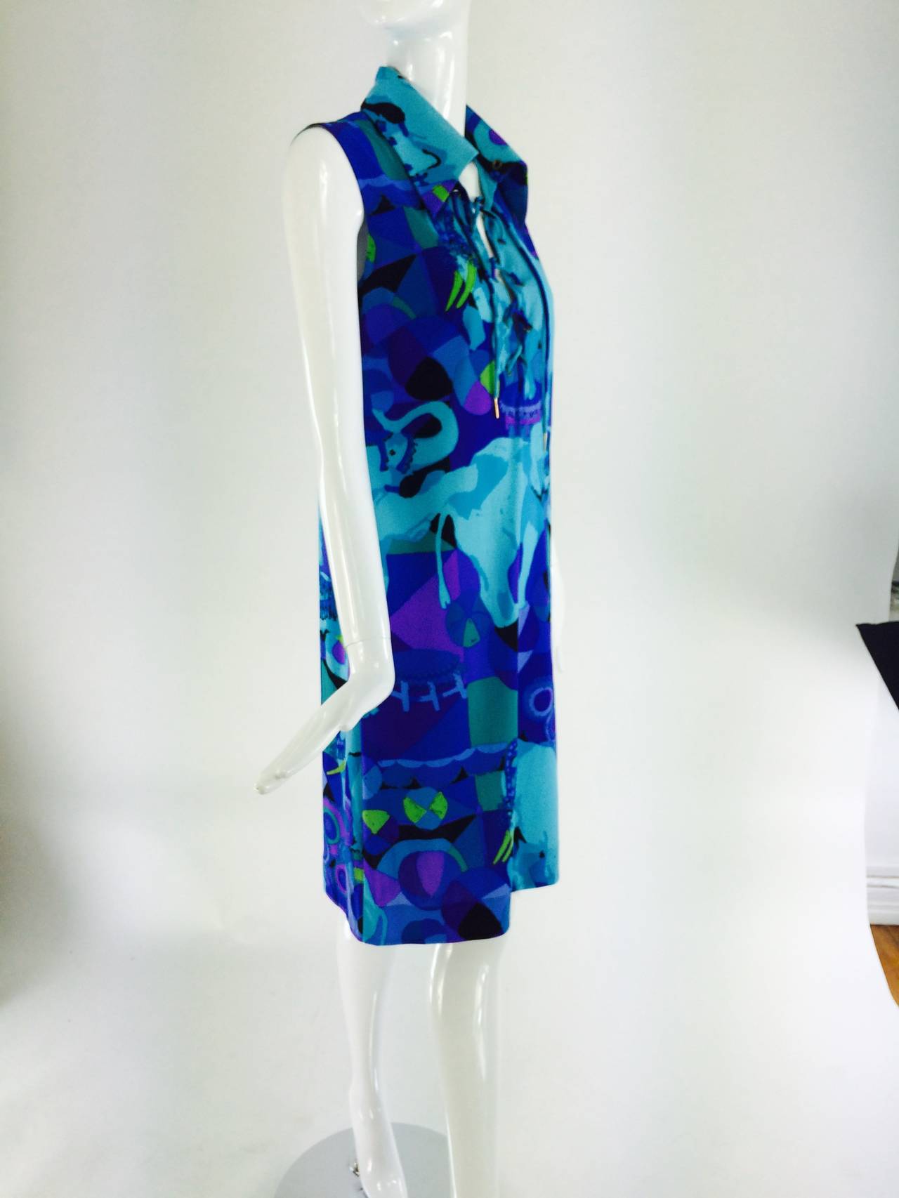 Ken Scott safari style dress from the 1970s in a wonderful print done in shades of purple, aqua, burgundy, teal & chartreuse, fabric designed by Susan Nevelson who still designs prints for Ken Scott (who passed away in 1991) Ken Scott's company is
