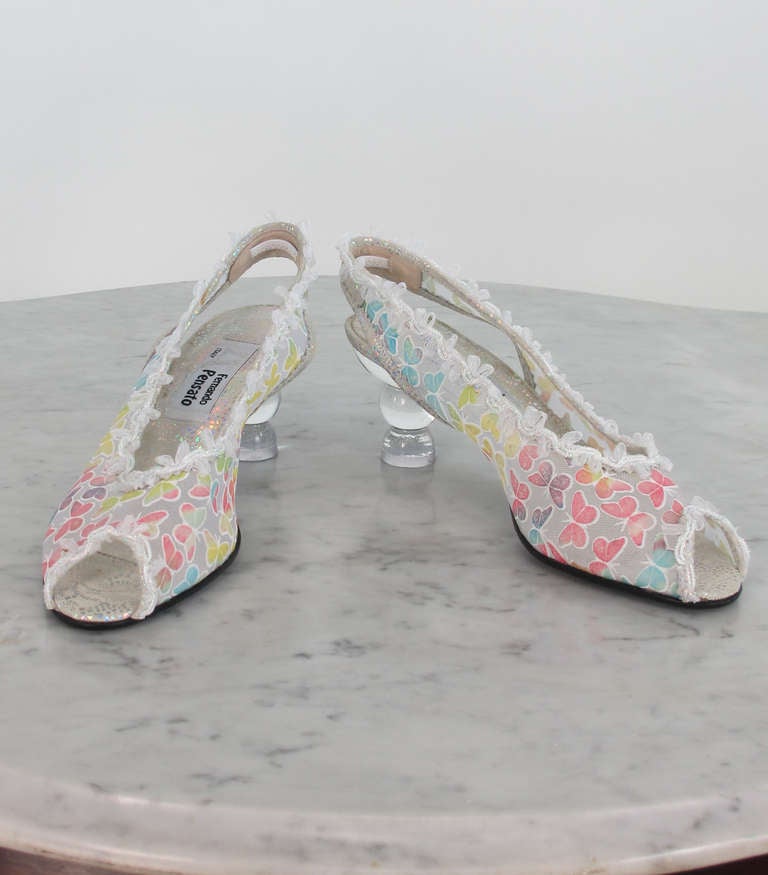 2000 Fernando Pensato Lucite heel, peep toe, butterfly sling back pumps...Introduced by Pensato for the millennium, the glass heeled shoe, of embossed mesh with pastel butterflies, the top edges are trimmed with iridescent ribbon bows ...The heels