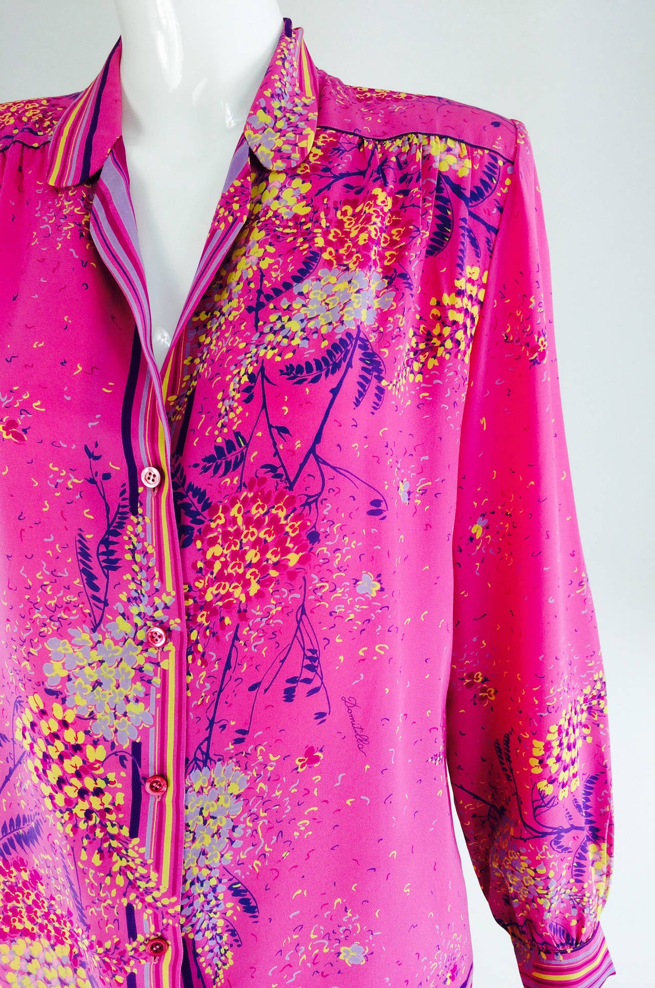 Domitilla is a hard to find label from the 1970s & 80s...Made in Firenze, Italy the dresses were done in silks and silky poly knits in brilliant colours and eye popping prints...From the 1980s a silk print top and skirt...Hot pink silk with a floral