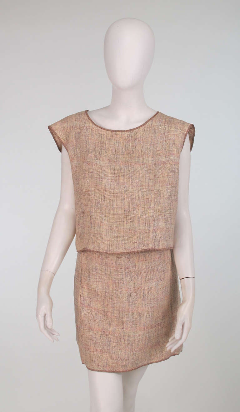 Chanel linen tweed skirt & top...Extended shoulder top closes at the back with Chanel logo buttons, unlined...Matching mini skirt is lined in maize cotton tweed, closes at the back with a zipper and bar hook...Marked size 40...Fits like a modern