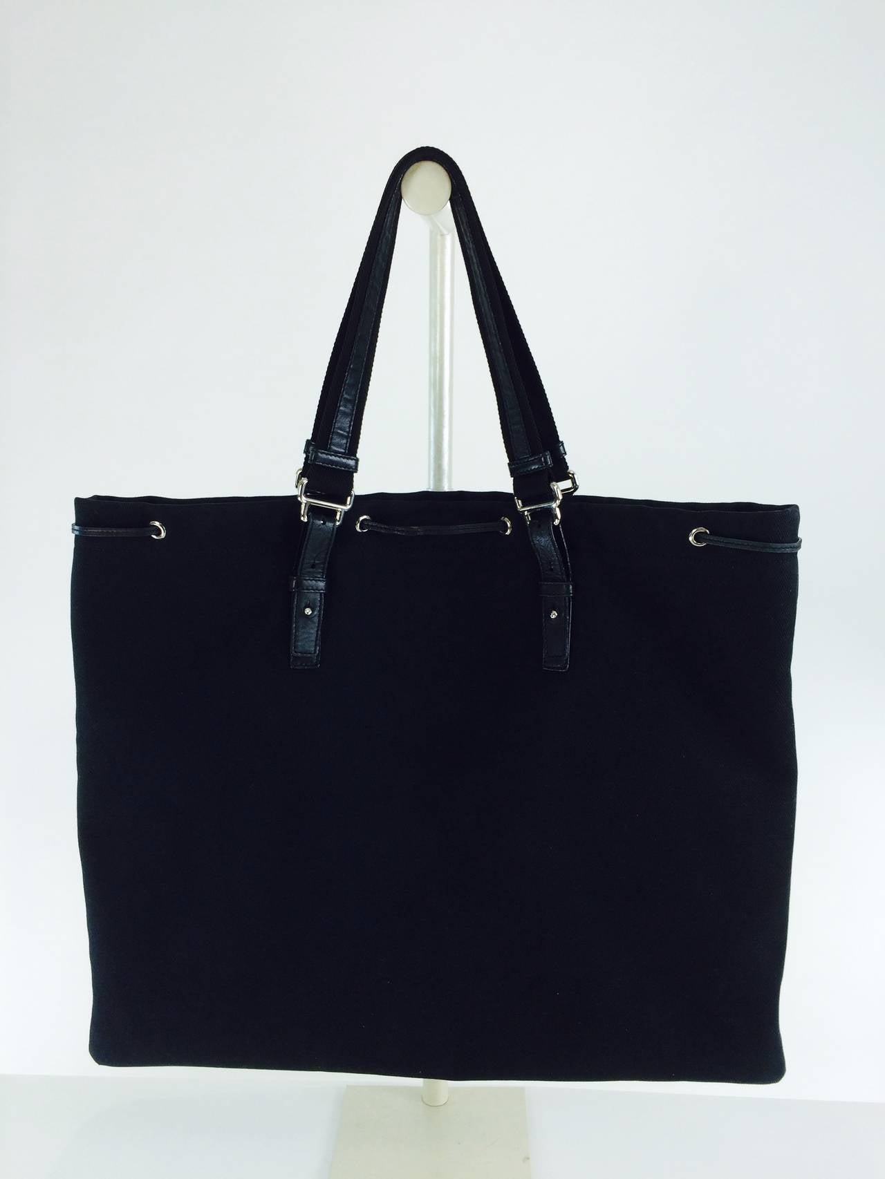 YSL large black canvas tote bag, YSL initals in black velvet appliqued at the front, black leather and black canvas handles (adjustable), silver hardware with black leather drawstring at the top...The bag is lined in black satin and has a single