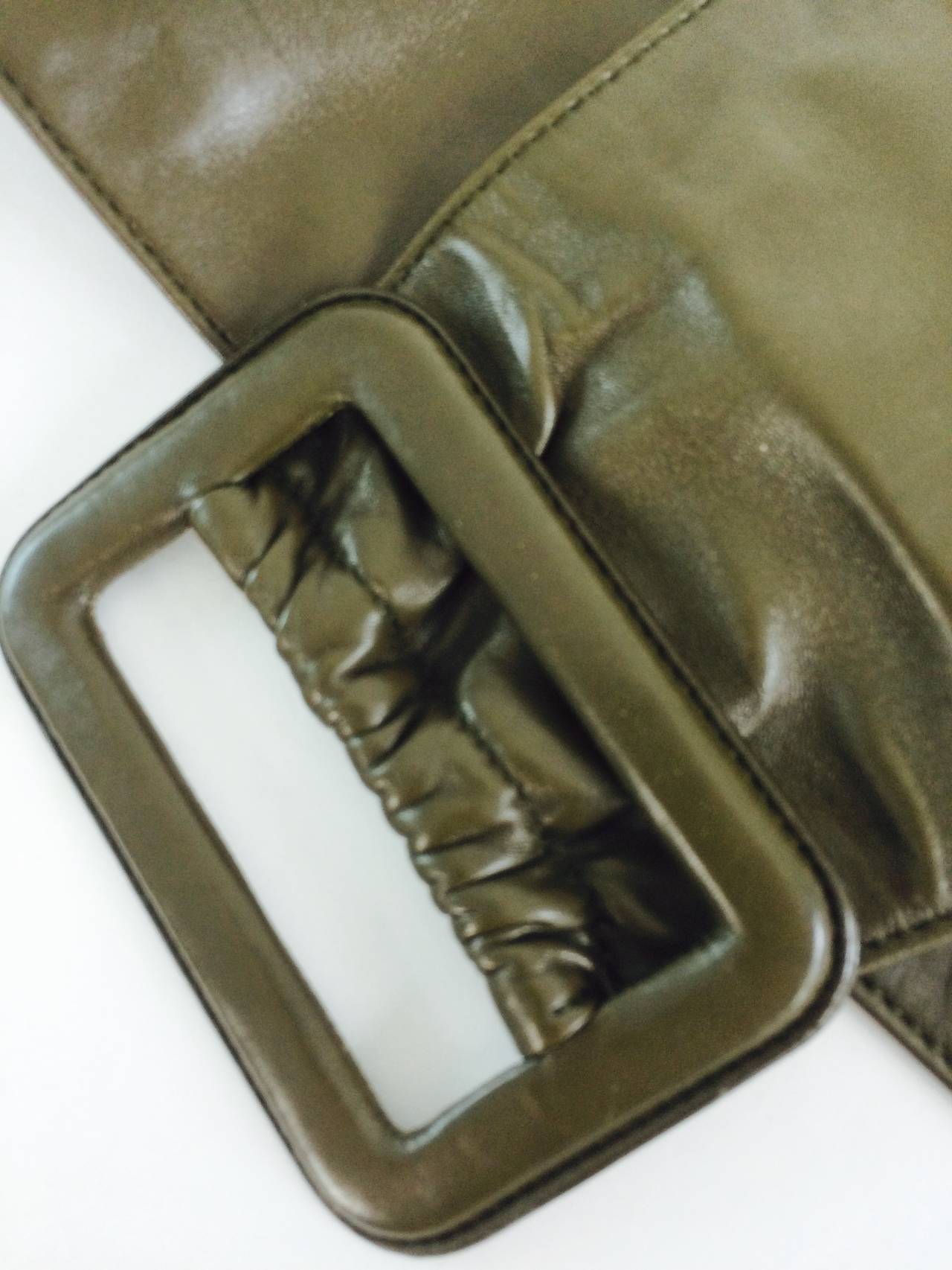 Prada buttery soft wide leather contour belt in a colour mixture of cocoa brown with a bit of olive green...The belt is lined in the same beautiful leather...With a wide buckle of leather...Marked size 36...In excellent condition....

Measurements