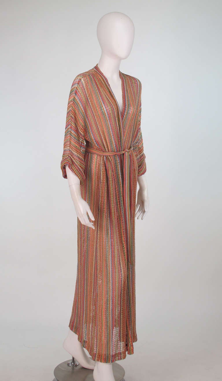 1970s Missoni coloured string crochet maxi wrap coat and original matching belt...Bat wing sleeve...Side pockets...Gathered turn back sleeve...Sleek 70s style in Missoni's famous colour palette...Appears unworn...Fits a modern S-M

In excellent