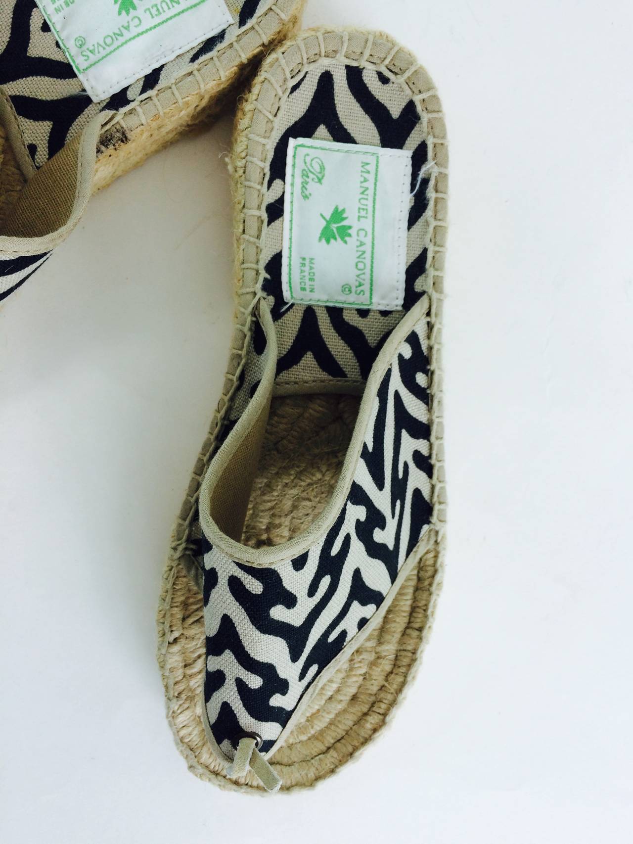 Manuel Canovas tribal print canvas thong espadrilles in off white and black...Thick woven jute sole, they look barely if ever worn...Marked size 37