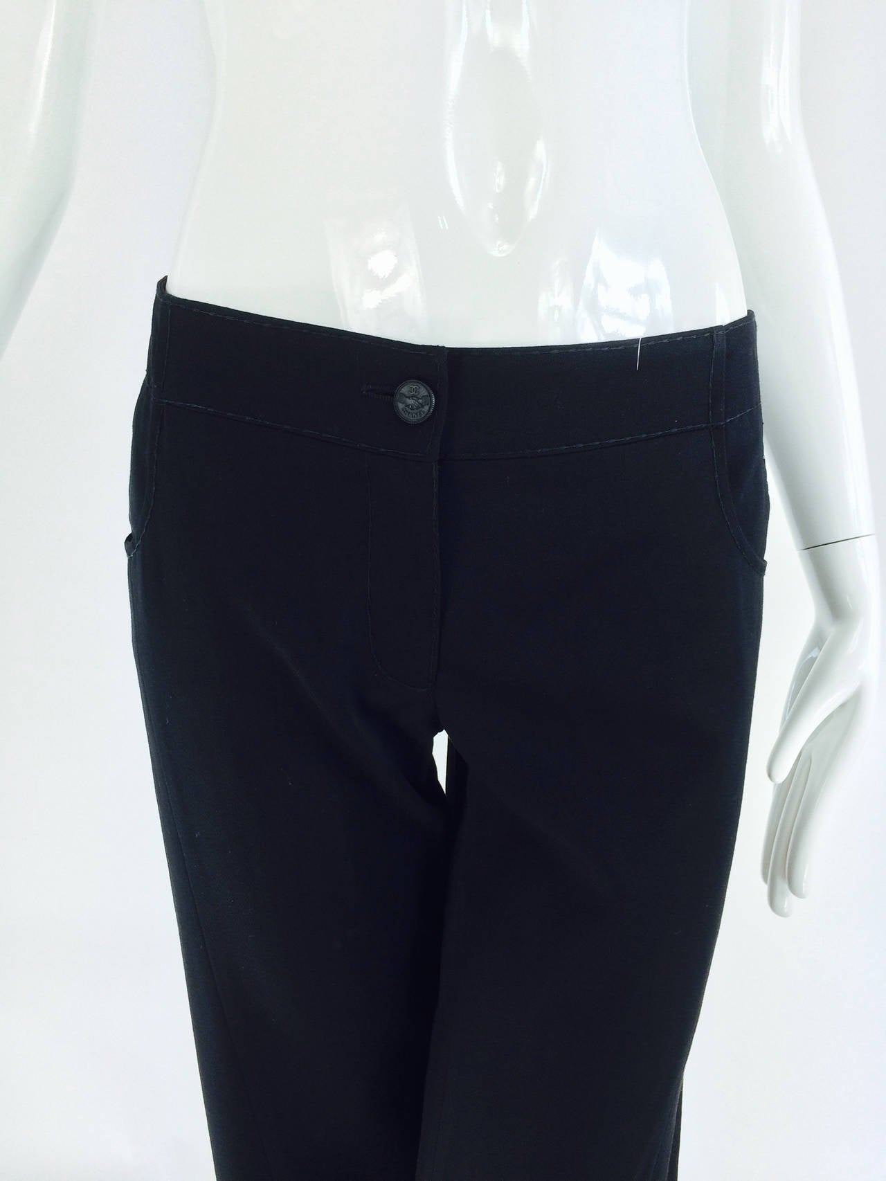 Chanel black wide leg cropped wool twill trouser, 2008 ...Super fine wool twill fabric in a classic variation of blue jeans...Low rise with a wide band waist/hip, rounded hip pockets, button closure with zipper fly, top stitched...Yoke back with