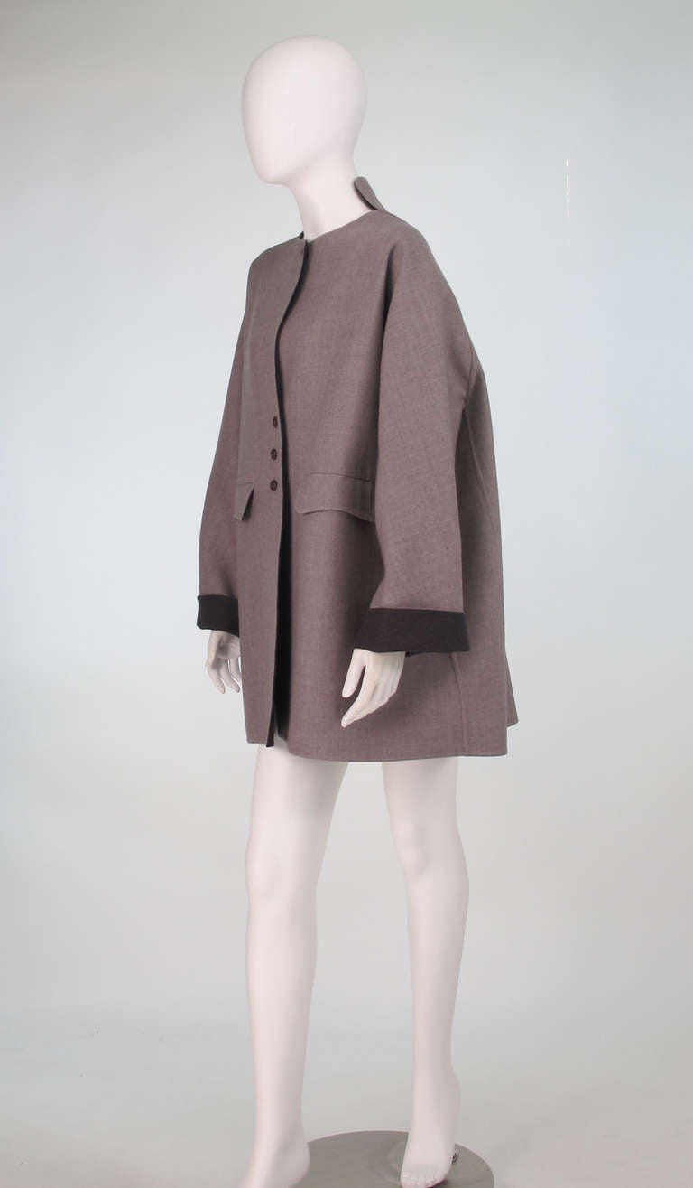 Effortless Chic could best describe this double face wool coat from Geoffrey Beene...Couture quality, with his signature inventive cut and choice of luxurious double face wool it's a coat that will never go out of style! Over sized coat is cut in