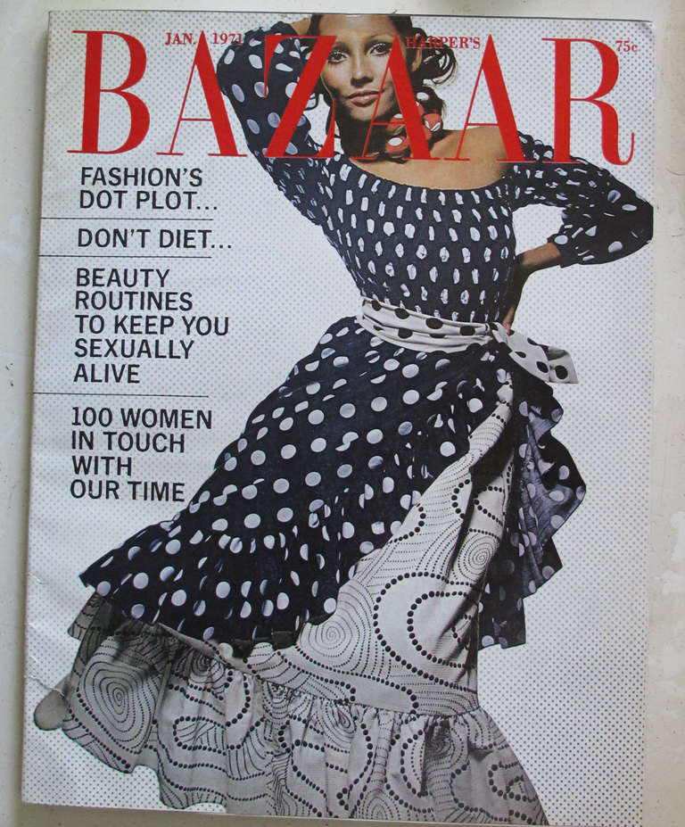 Featured on the cover of Harper's Bazaar, January 1971...Oscar de la Renta Boutique dress & over-skirt with matching self tie belt...Great mix of prints in navy blue and white...The dress has a sheared elastic bodice with a low scoop neckline and
