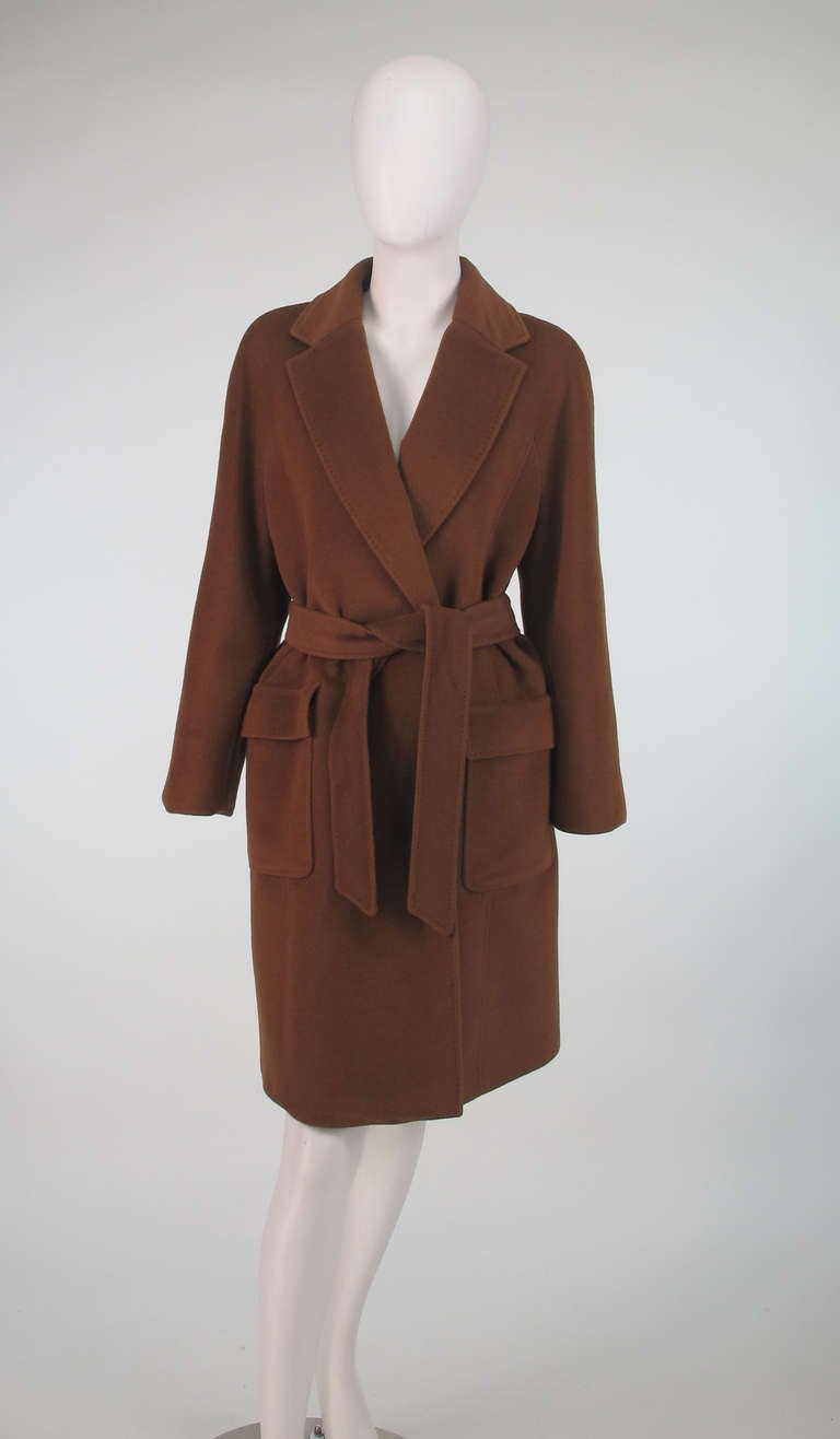 Classic trench style wrap coat in luxurious dark camel cashmere from Jaeger, London…Wrap front coat has notched lapels, raglan sleeves, interior ties, hip front patch flap pockets, top stitch detailing and back center hem vent…Fits like a 4…
In