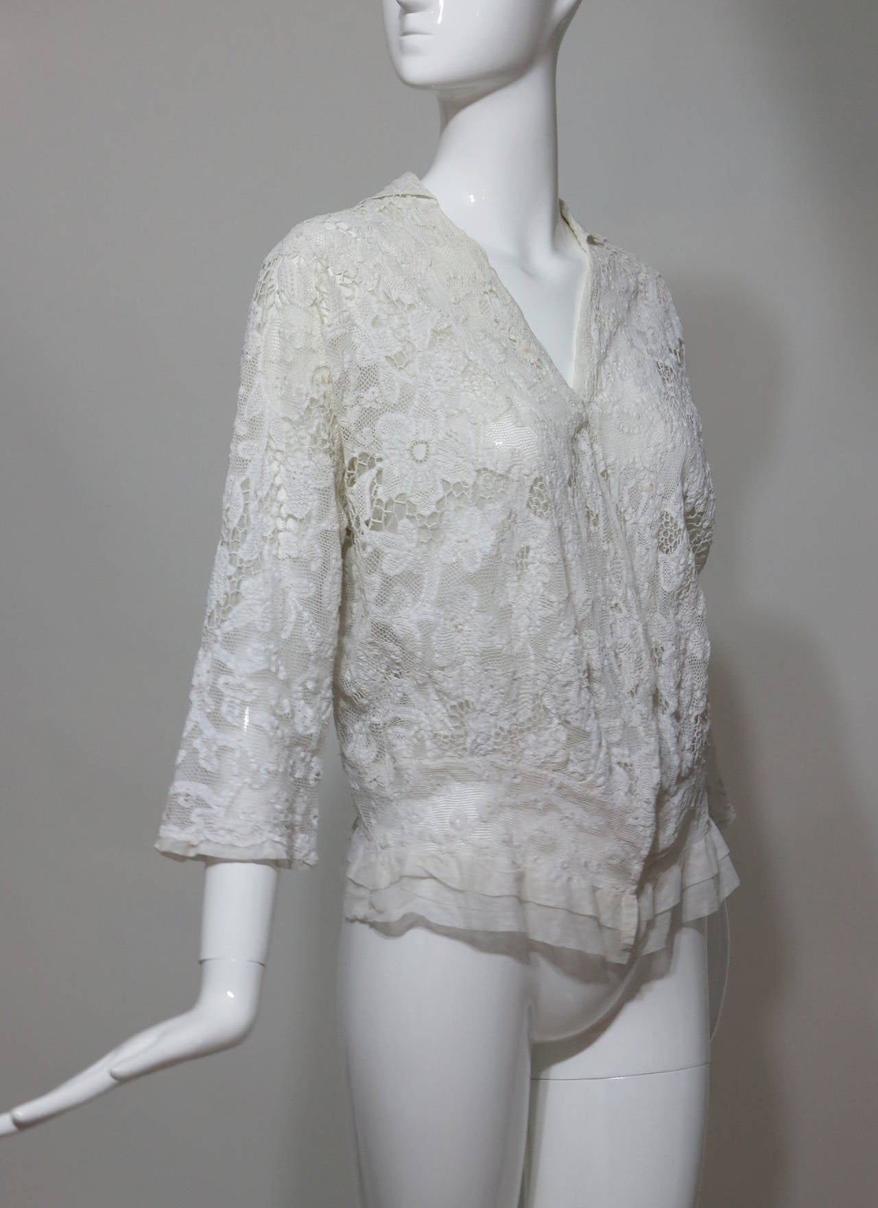 Handmade mixed lace Edwardian jacket or blouse in off white...Combining fine quality tape lace with needle lace and a hem of Milanese lace this is a beautiful example of the lace makers art...The jacket is open at the front with a small collar at