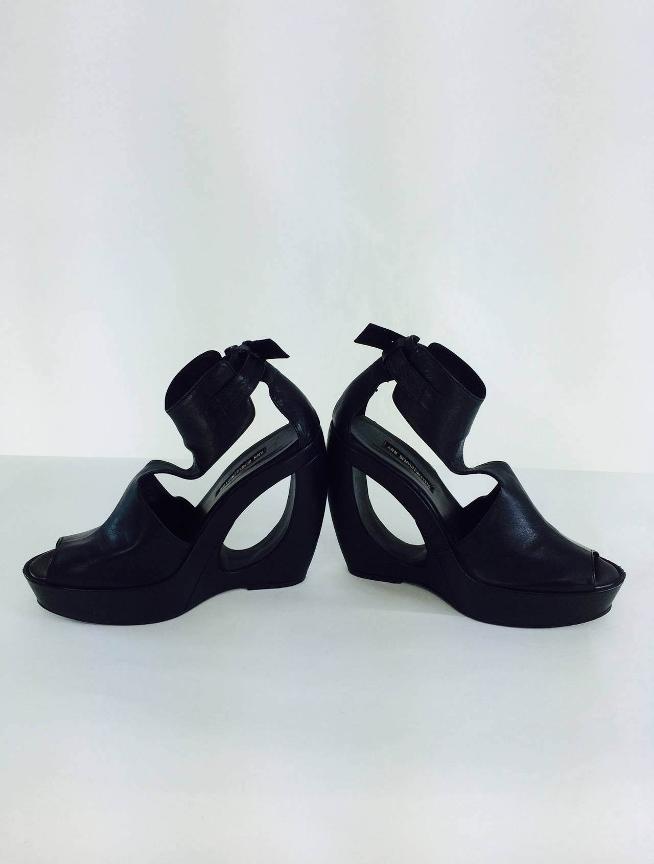 Ann Demeulemeester black leather cut out wedge platform shoes, with buckles at the ankles...Soft black leather with molded shape heel covered in black leather...Marked size 39, in very good barely worn condition...