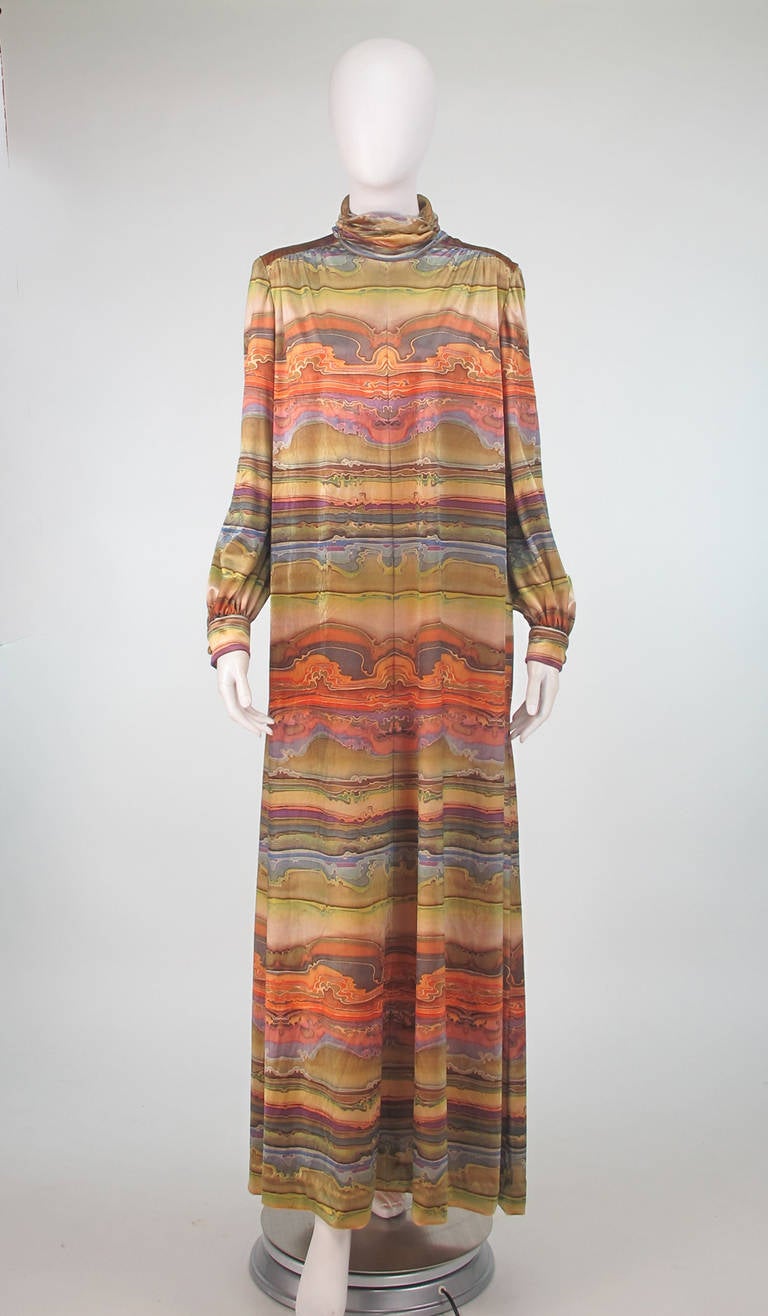 An amazing panne velvet caftan from the 1970s labeled Martha, Palm Beach...Appears unworn...The fabric is gorgeous, silky with a sheen, the print in evening desert shades has a very 1970s vibe...Perfect for entertaining at home, but could easily be