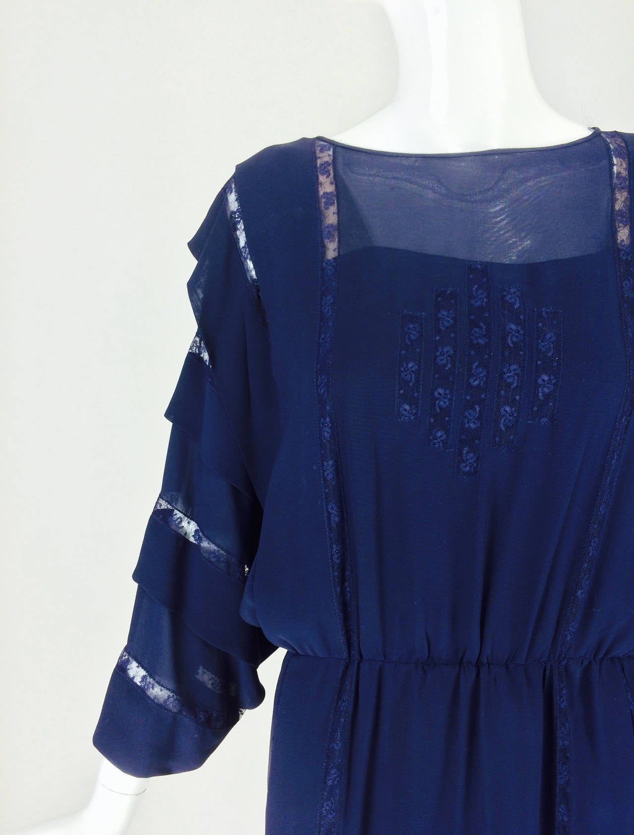 Chloe by Karl Lagerfeld blue chiffon lace insertion dress early 1980s...navy blue chiffon bat wing sleeve dress with sleeves that alternate with tucks and lace insertion...The dress front has a panel of lace insertion...Round banded neckline...The