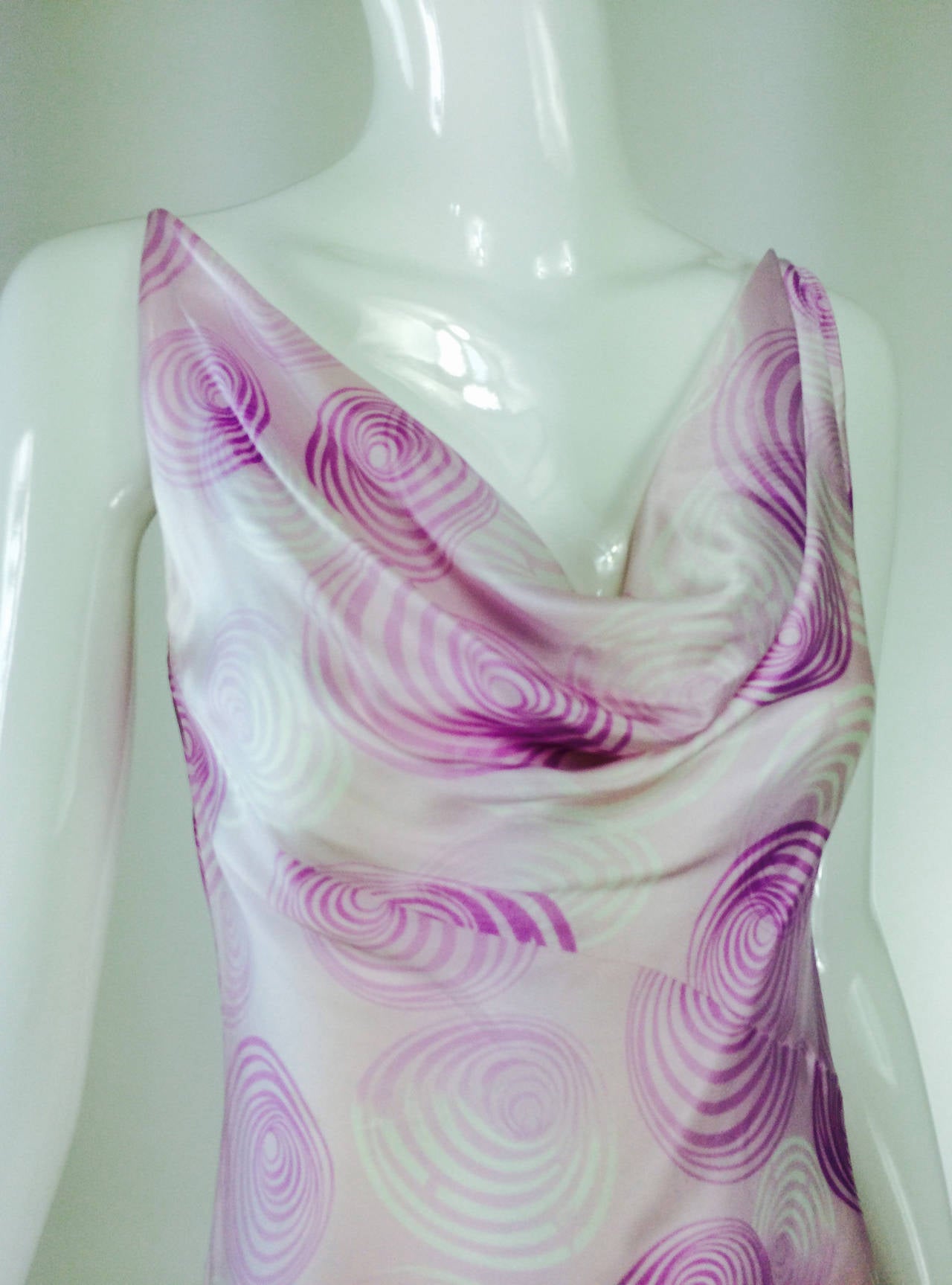 Escada bias cut silk spiral print cowl neck dress 1990s...Pink silk dress is printed in spirals of dark pink and white...Narrow shoulder strap dress with deep cowl neck, bias cut dress, low back, button and loop closure at the back, asymmetrical