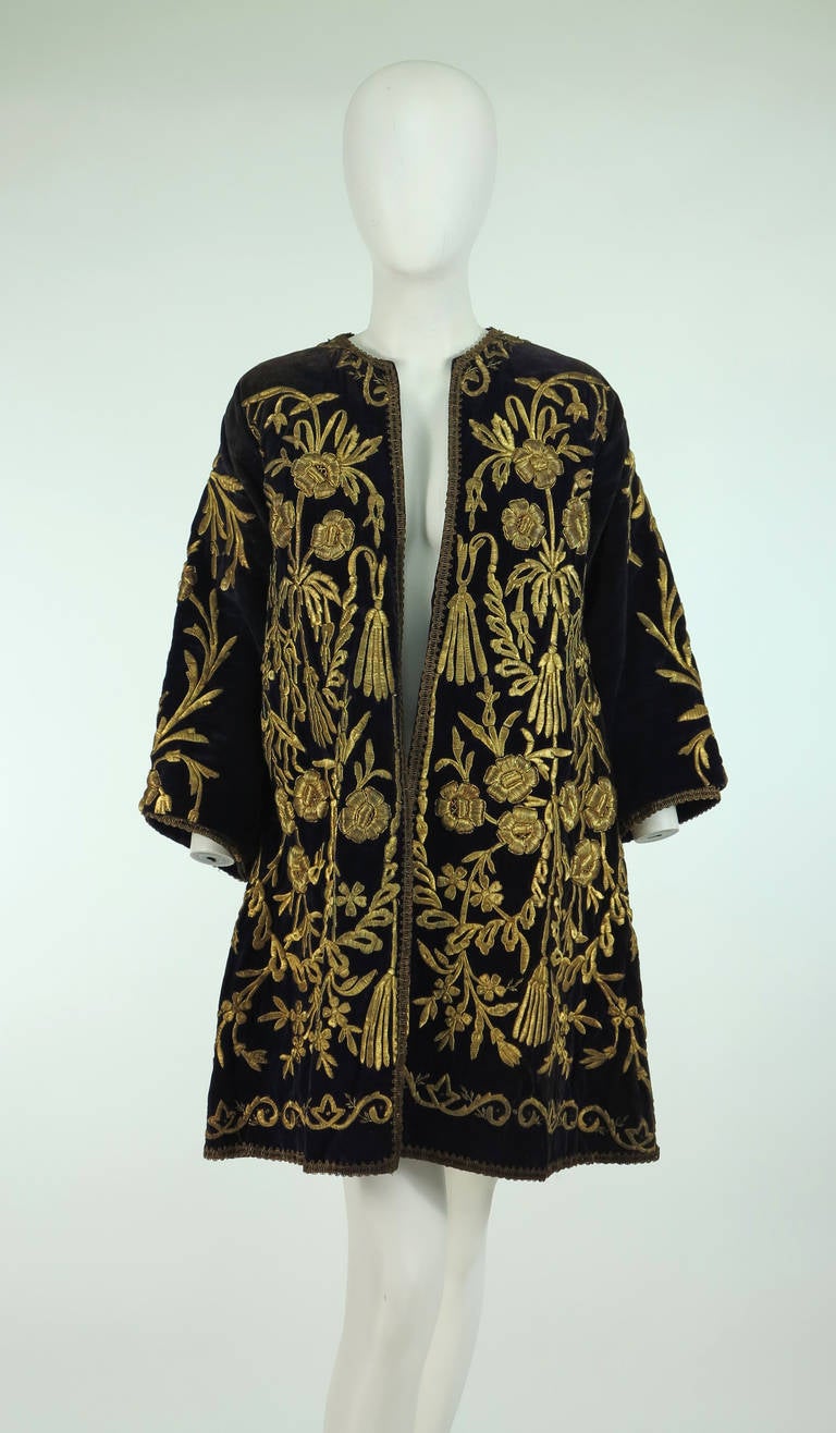 19th Century Ottoman Empire period purple cotton velvet coat with gold metallic padded satin stitch embroidery...A wonderful example of the exquisite art of embroidery...The open front coat is A line shape, 3/4 length sleeves and a round