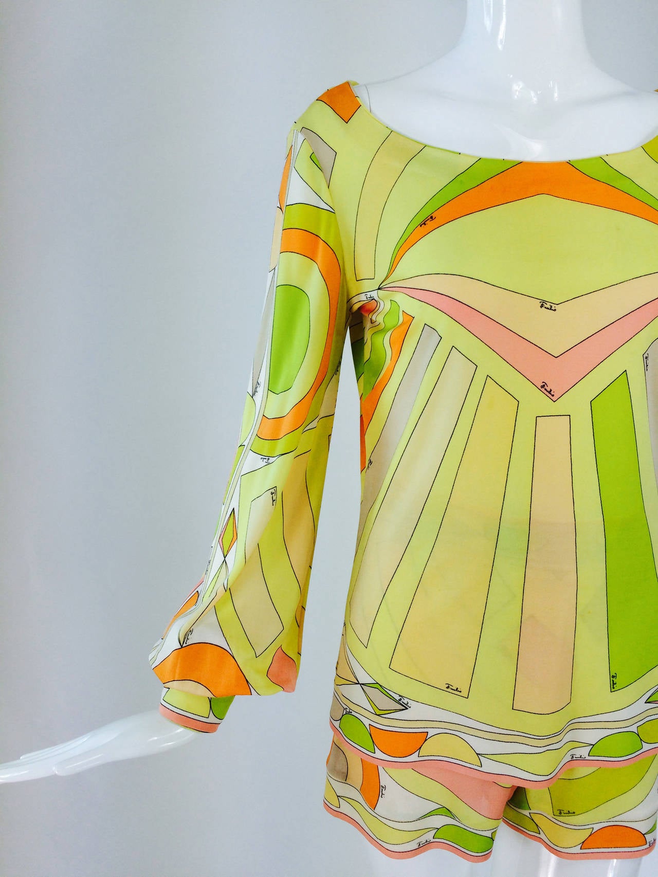 Emilio Pucci 2pc silk knit short & top set in hot citrus colours 1960s...Fabulous and hard to find...Bright lemon, lime, orange with coordinating shading...The two piece outfit features a long sleeve snap cuff, open neck hip length top that closes