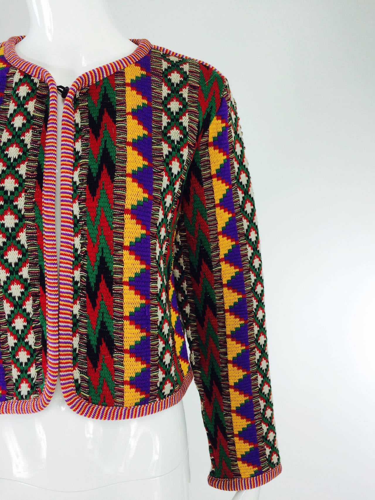 Yves St Laurent Rive Gauche geometric tribal knit sweater 1970s...A bohemian inspired design in deep rich colours...Long sleeve sweater is unlined, closes at the neck with a hook...100% wool...Marked size 38

In excellent wearable condition... All