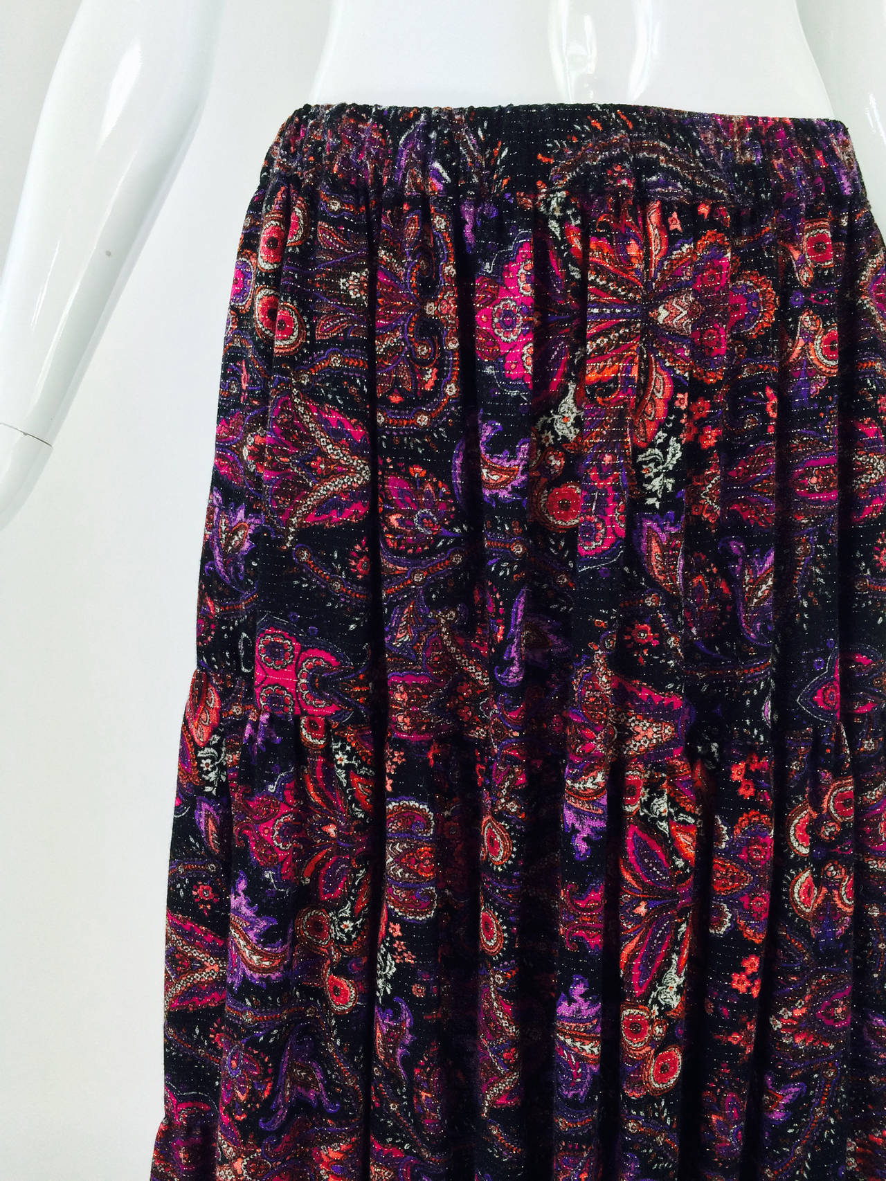 Yves St Laurent Rive Gauche metallic paisley tiered gypsy skirt 1970s...Triple tiered metallic paisley skirt in wine, hot pink, black & silver wool challis...wide cased elastic waist...Unlined...Marked size 38...

Please check the measurements